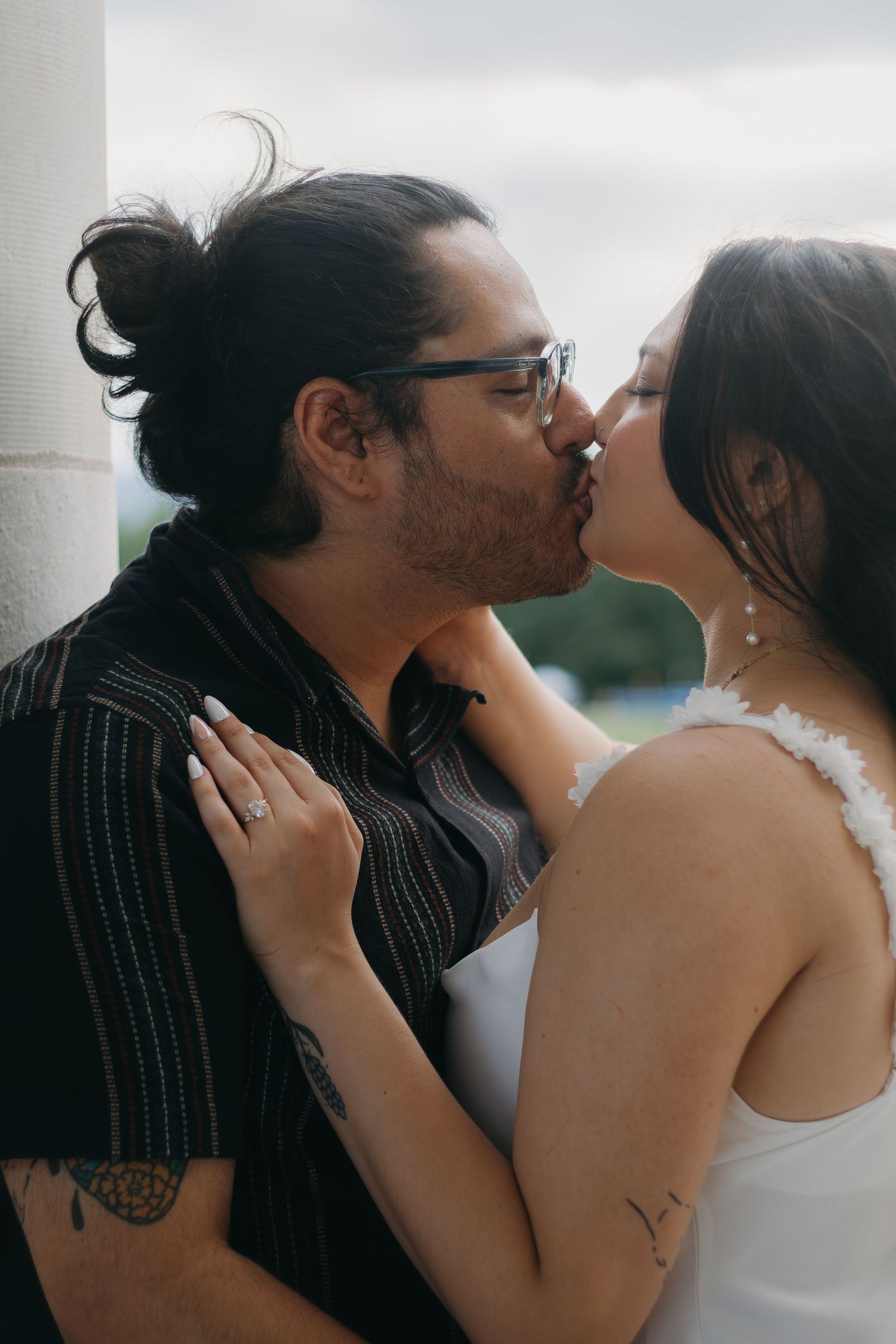 An intimate moment between a couple captured in soft, natural lighting.