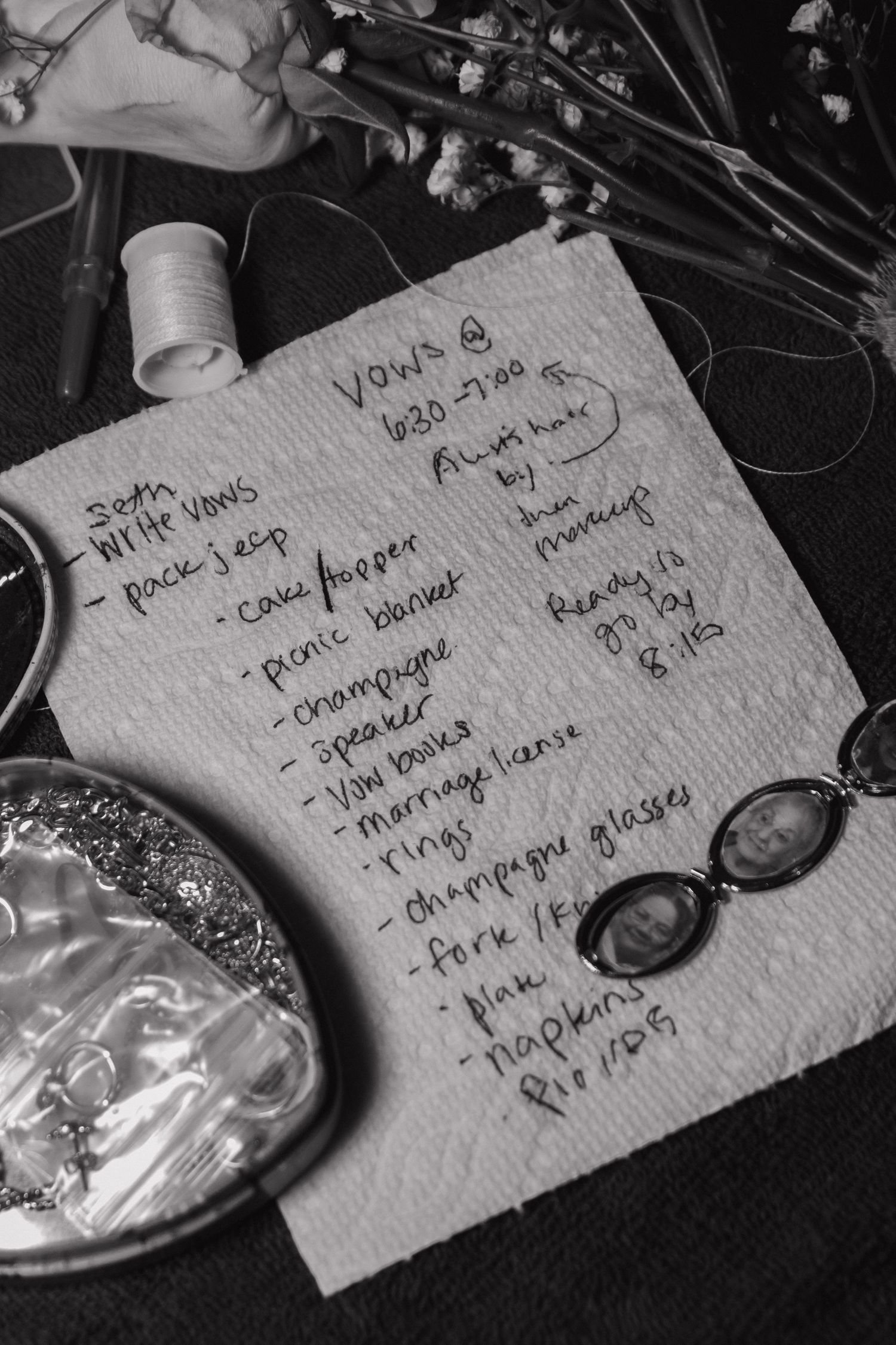 Handwritten notes and lists on white paper cards in black and white.
