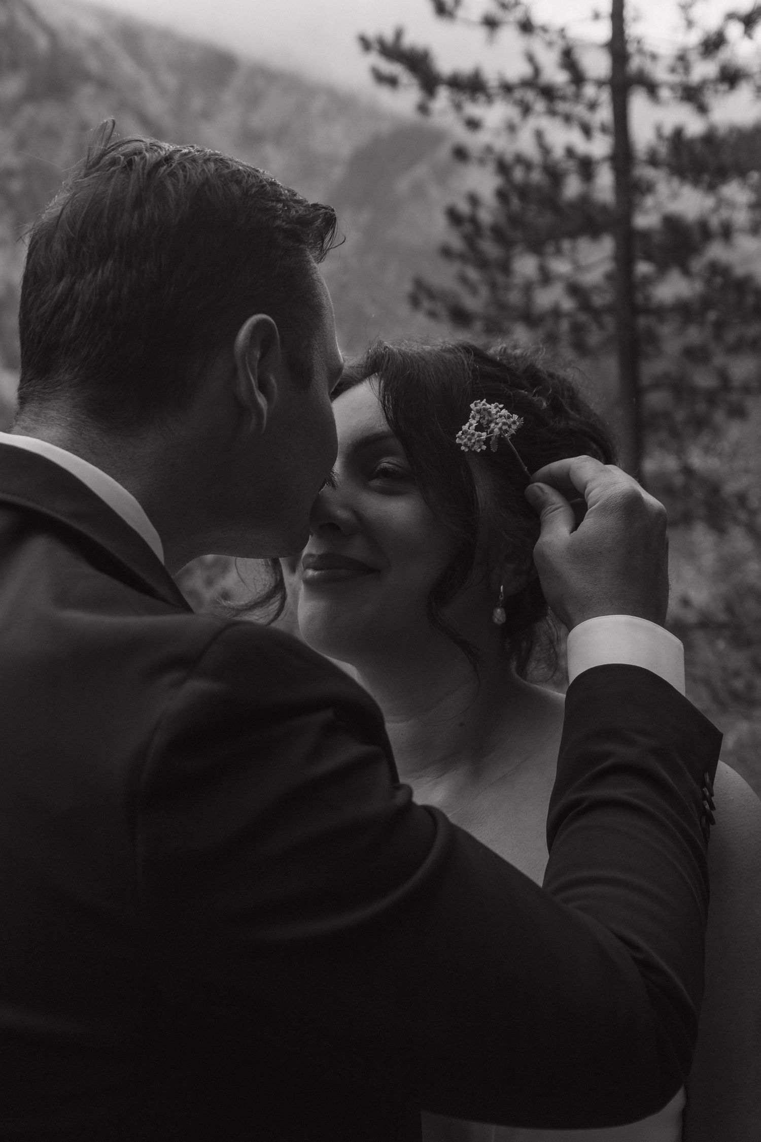 Intimate black and white wedding portraits captured in a mountain setting.