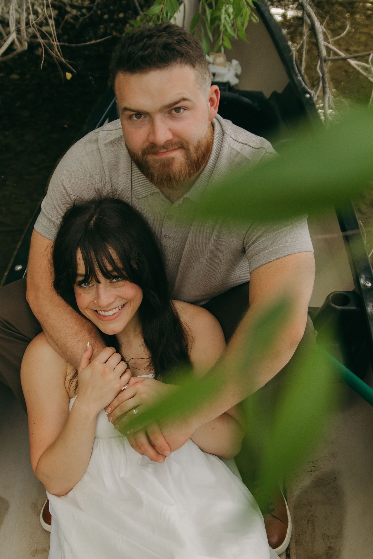 A joyful outdoor photo session showing genuine laughter and happiness.