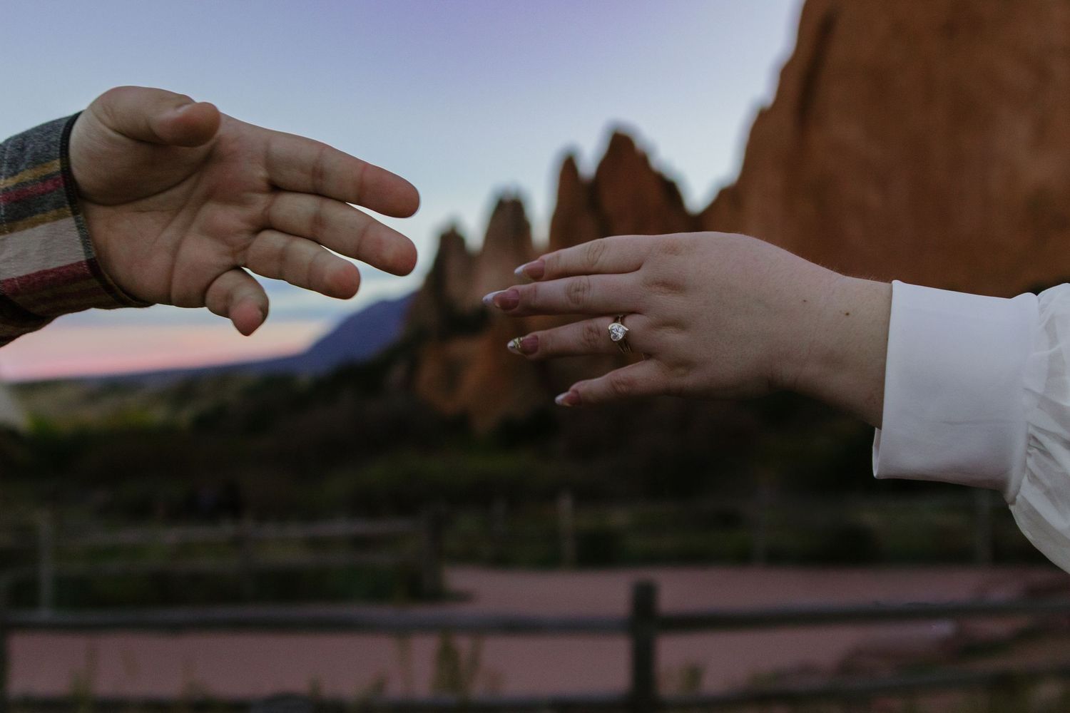 Close-up view of hands exchanging money in a business transaction.