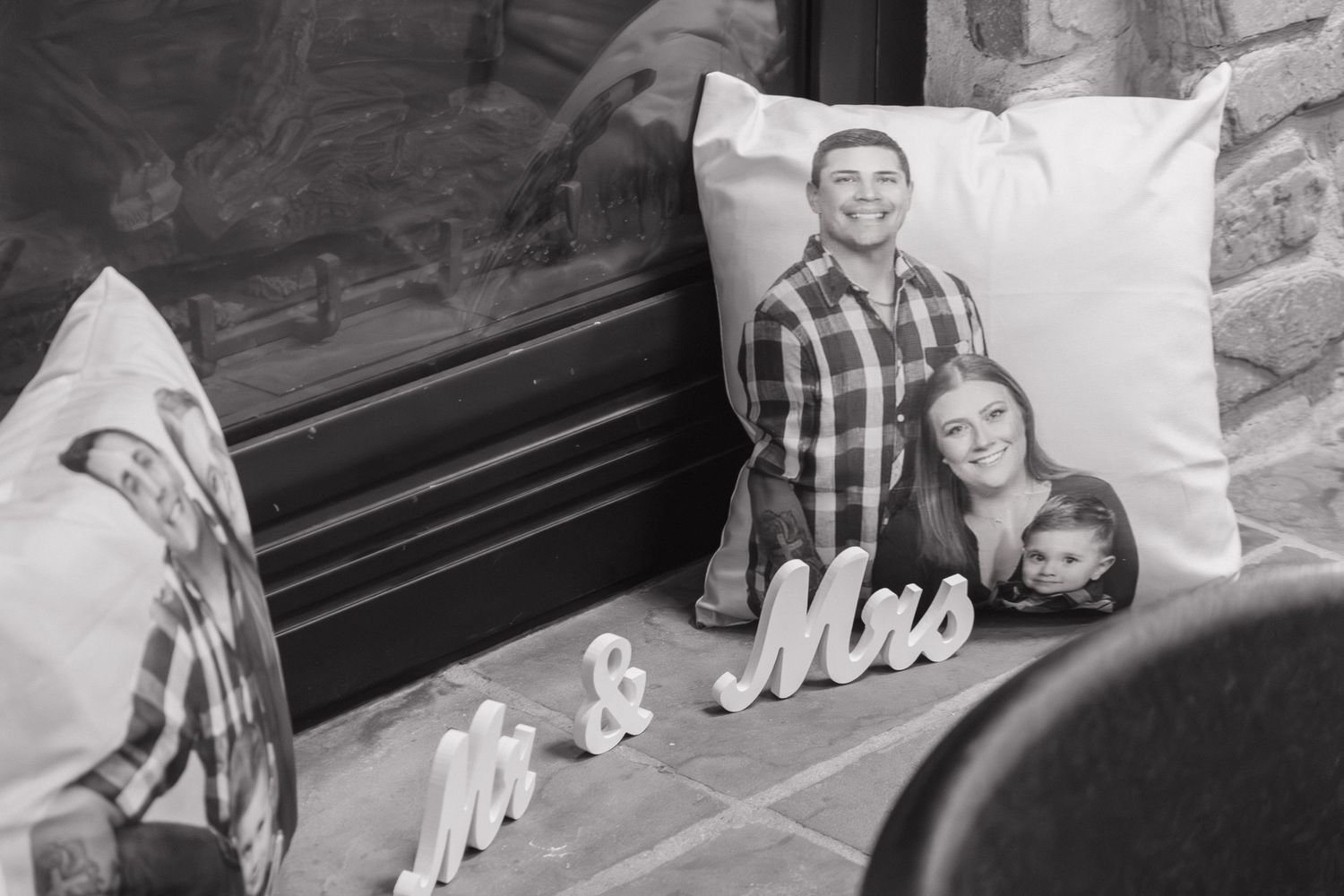 Black and white engagement photographs displayed in a collage style layout.