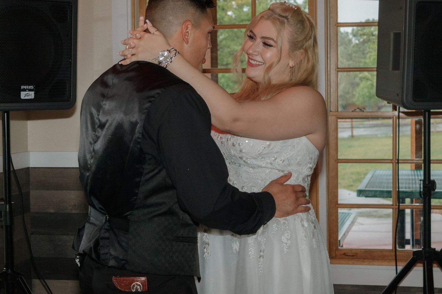 Couple sharing a romantic dance moment at their wedding reception.