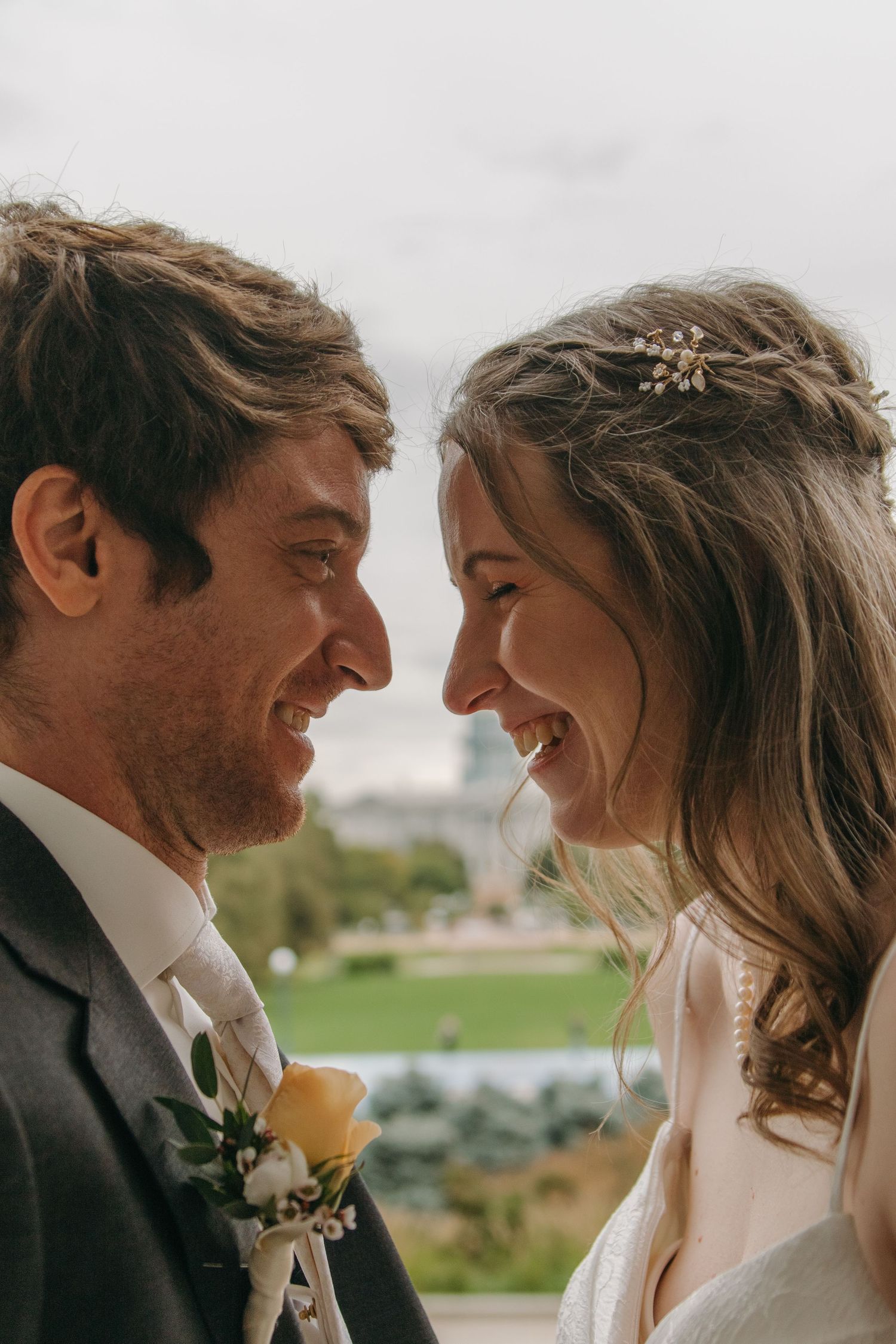 A romantic wedding couple shares intimate moments together in a series of candid outdoor portraits.