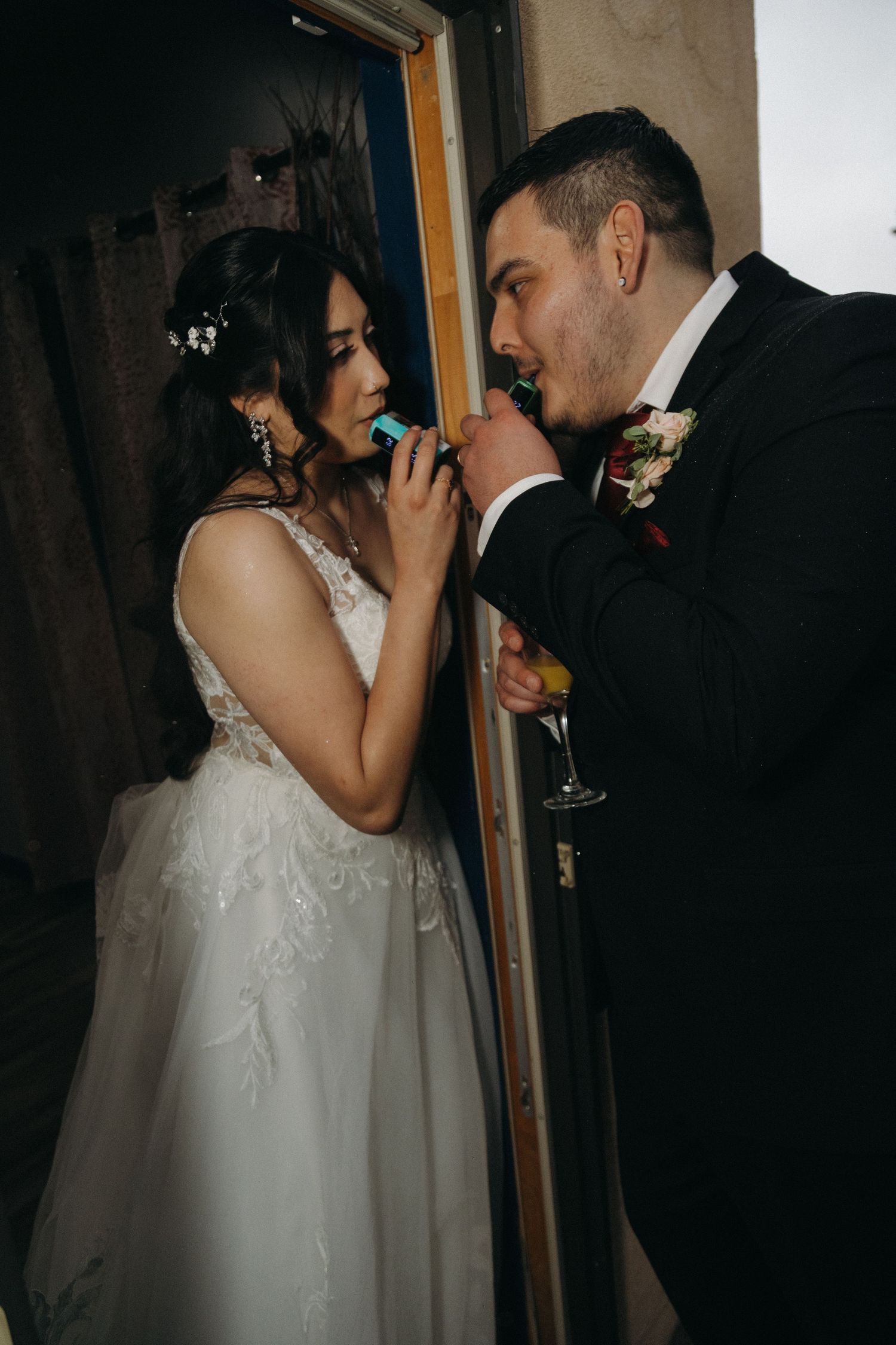 Bride and groom sharing a popsicle together at their wedding reception.