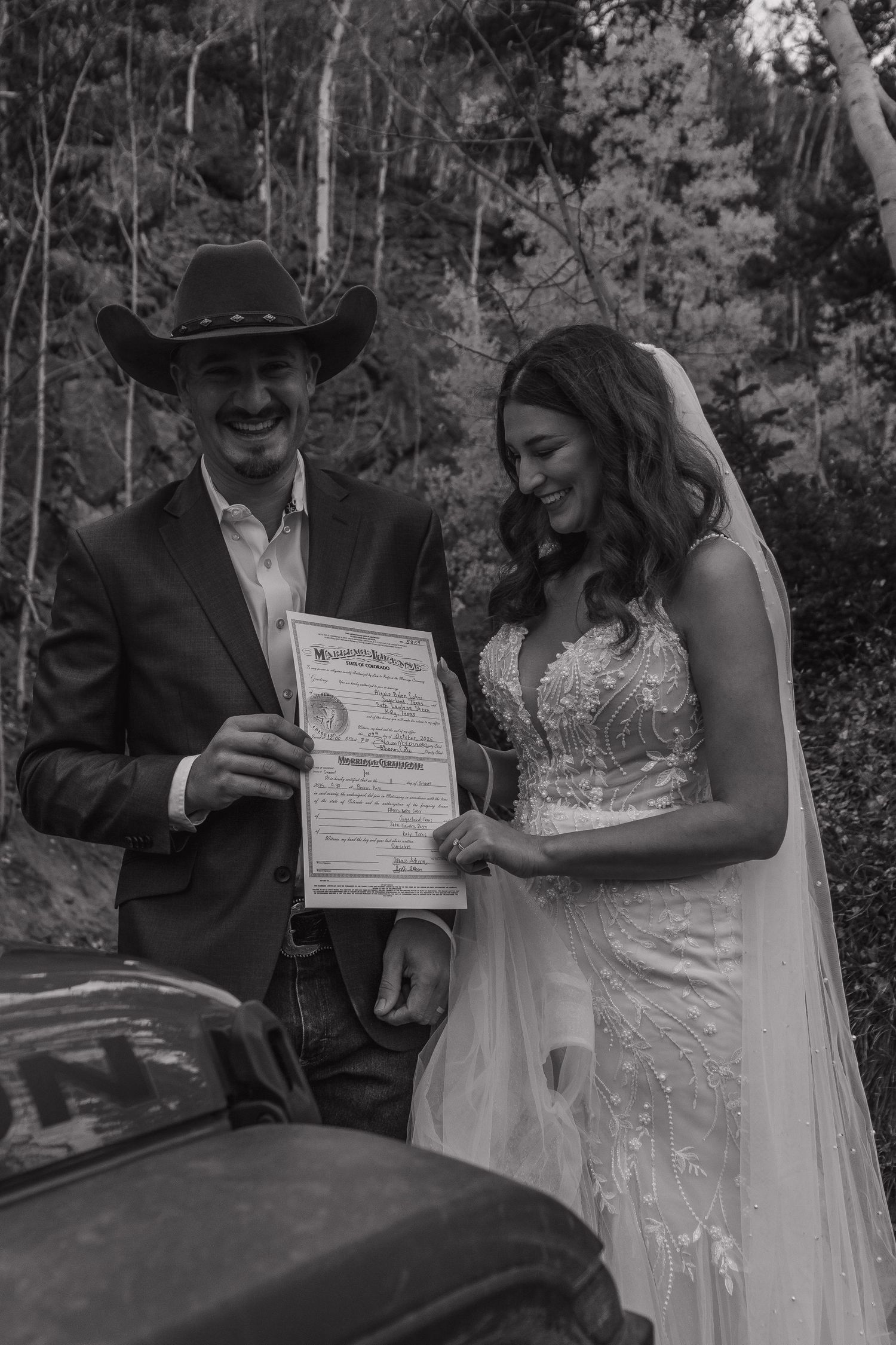 A couple signs wedding documents together in a black and white photo sequence.