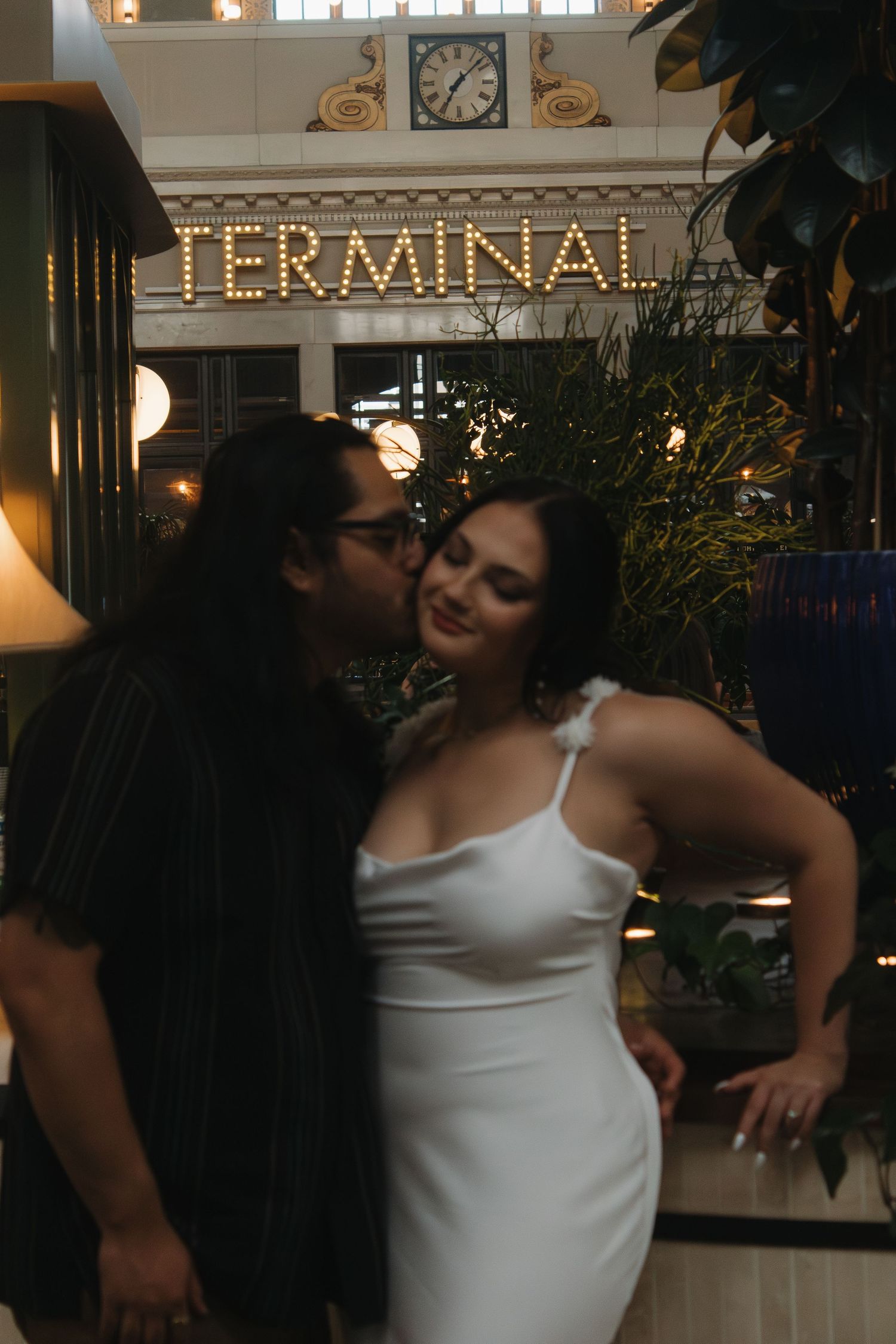 A couple shares an intimate moment in the Terminal Bar area.