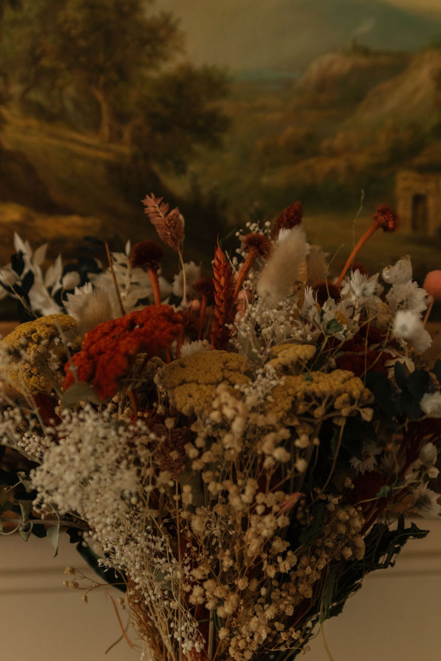 Colorful floral arrangements with white and red flowers create a stunning wedding display.