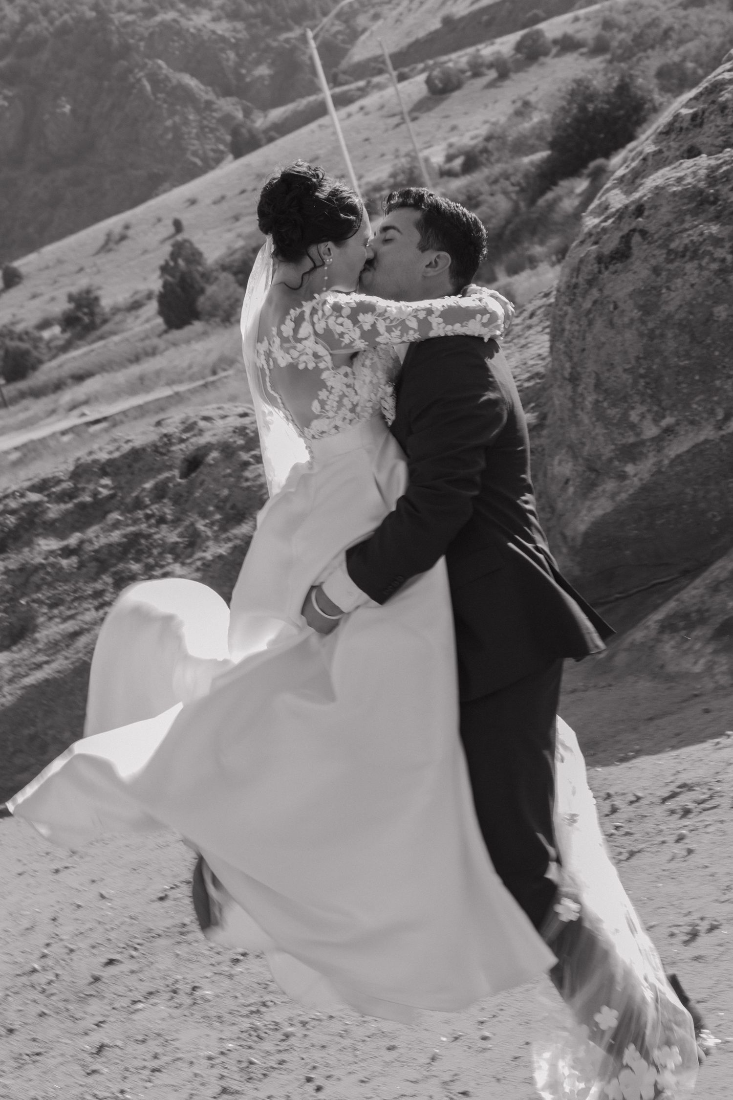 A black and white sequence shows a couple dancing together during their wedding photoshoot.