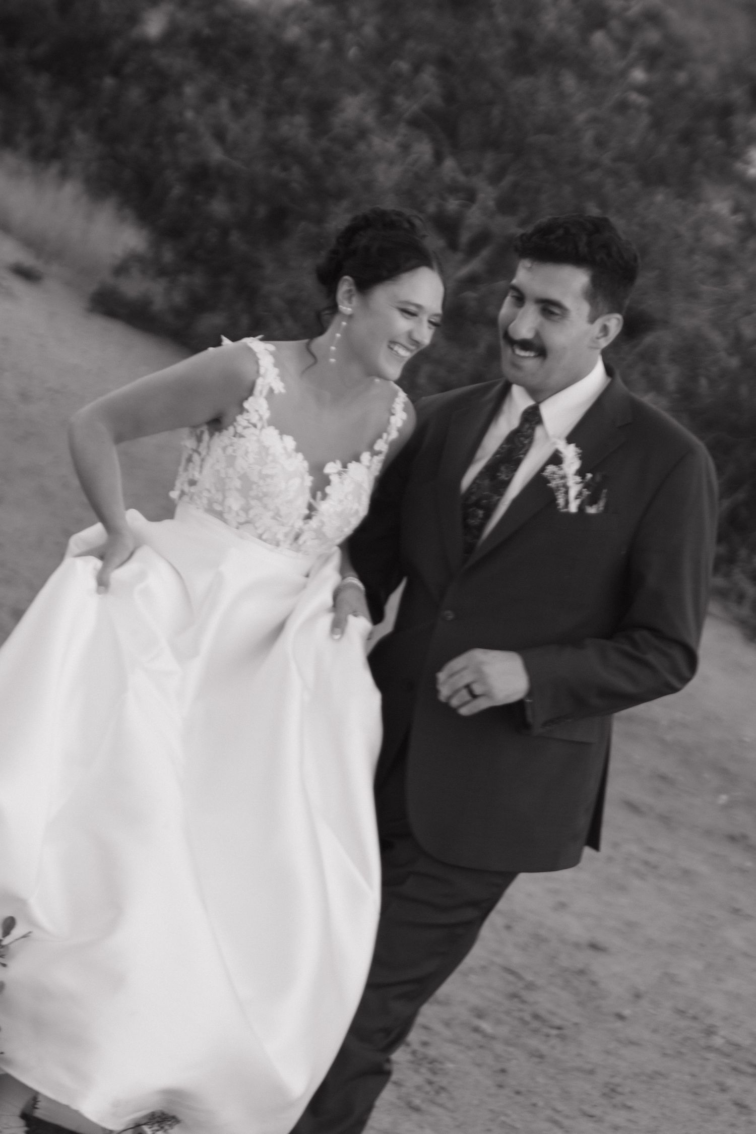 Black and white portrait series captures intimate moments between wedding couple.