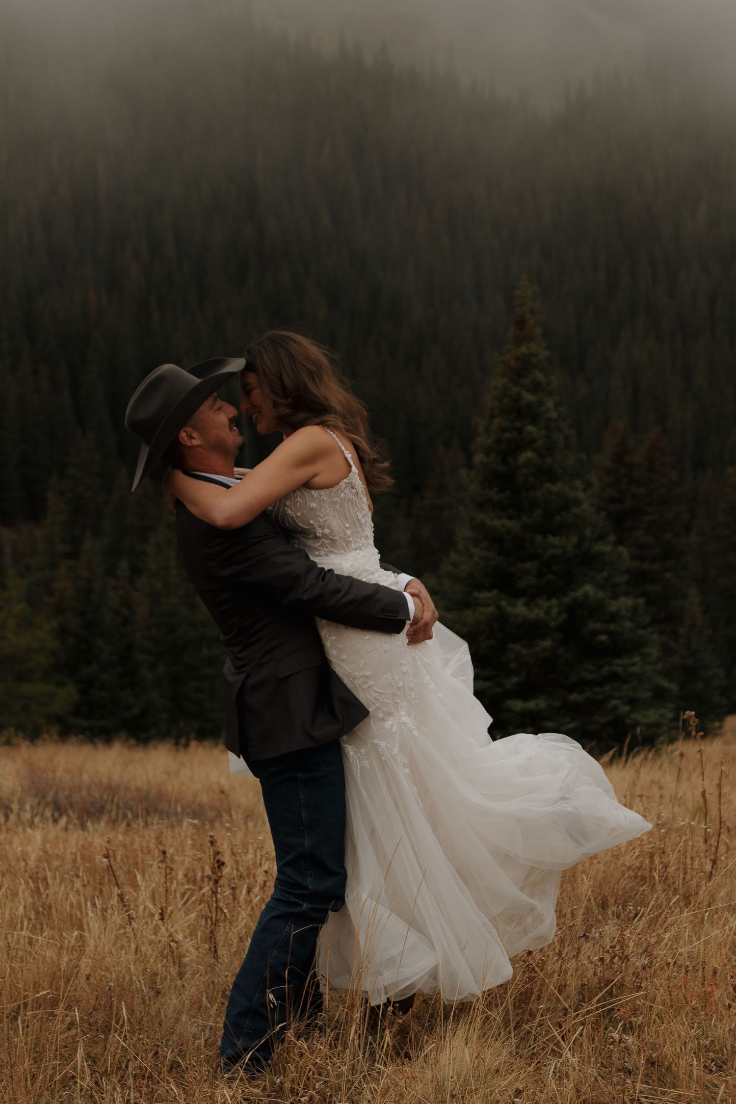 A romantic dance sequence in a golden mountain meadow surrounded by pine trees.