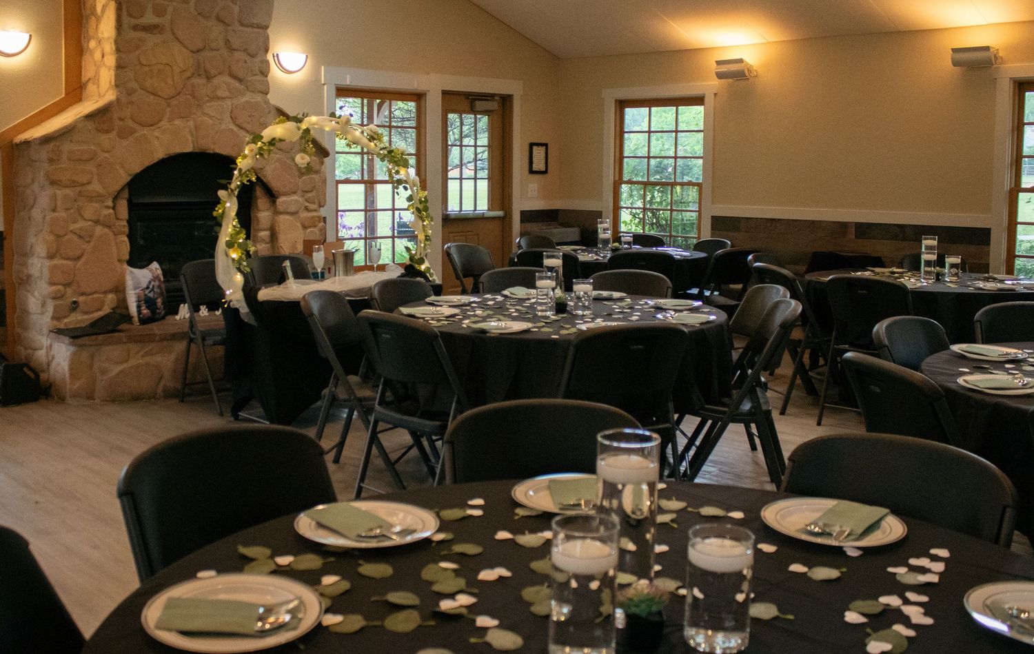 Elegant wedding reception venue with tables set for dining.