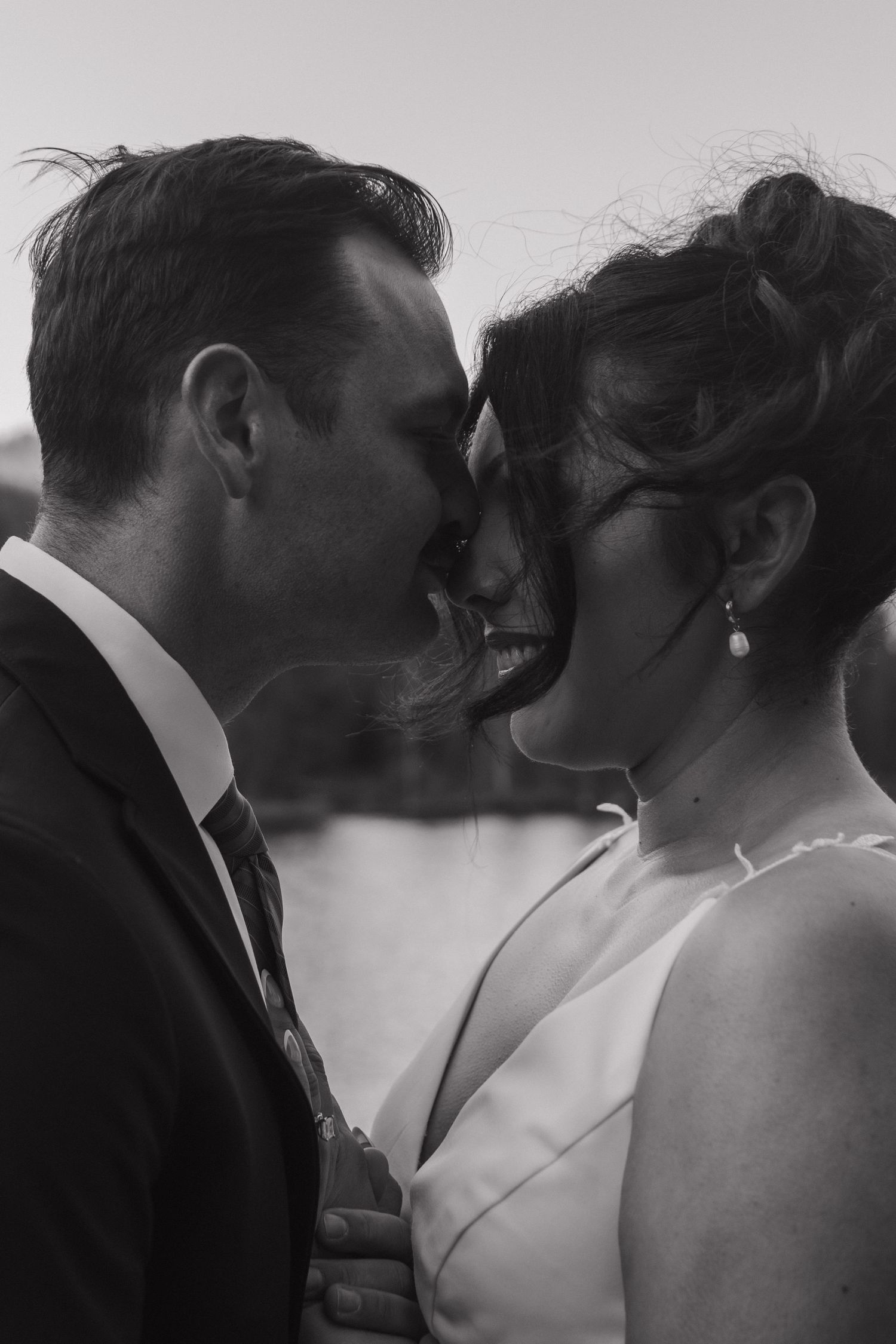 Romantic close-up wedding portrait sequence showing tender intimate moments in black and white.