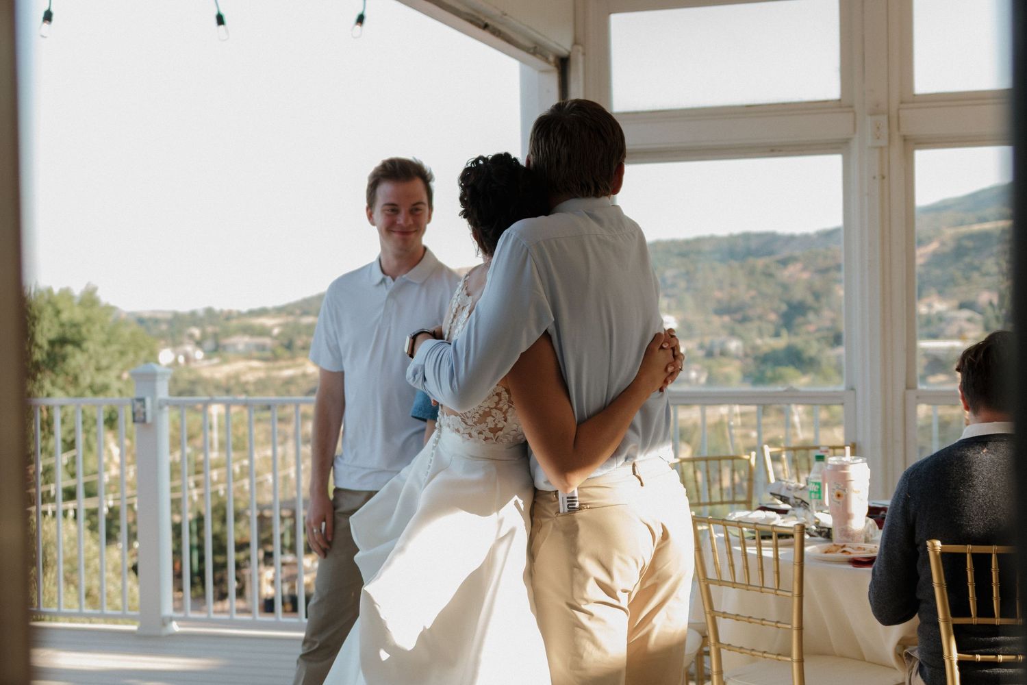 Panoramic view of wedding venue with mountains and scenic landscape in background.