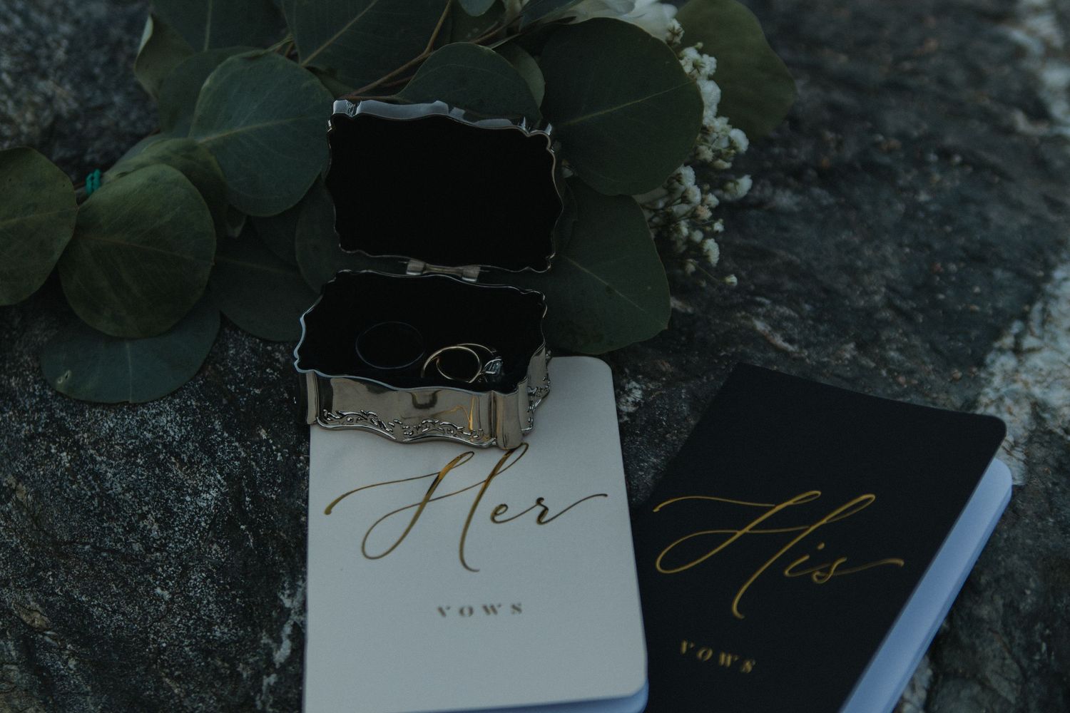 Wedding stationery and calligraphy set featuring black invitations and handwritten details.