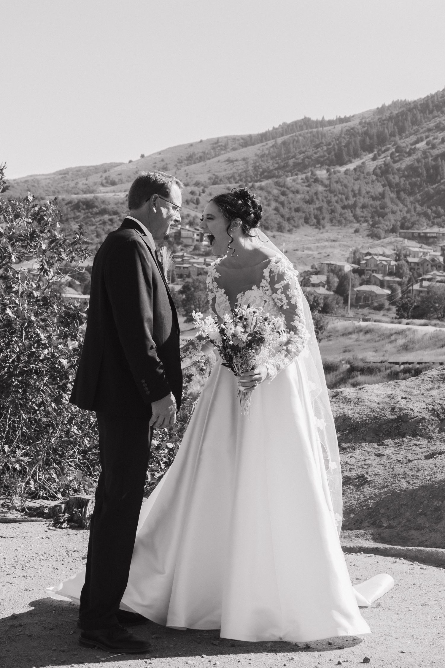 Black and white wedding photos showing couple against scenic mountain backdrop.