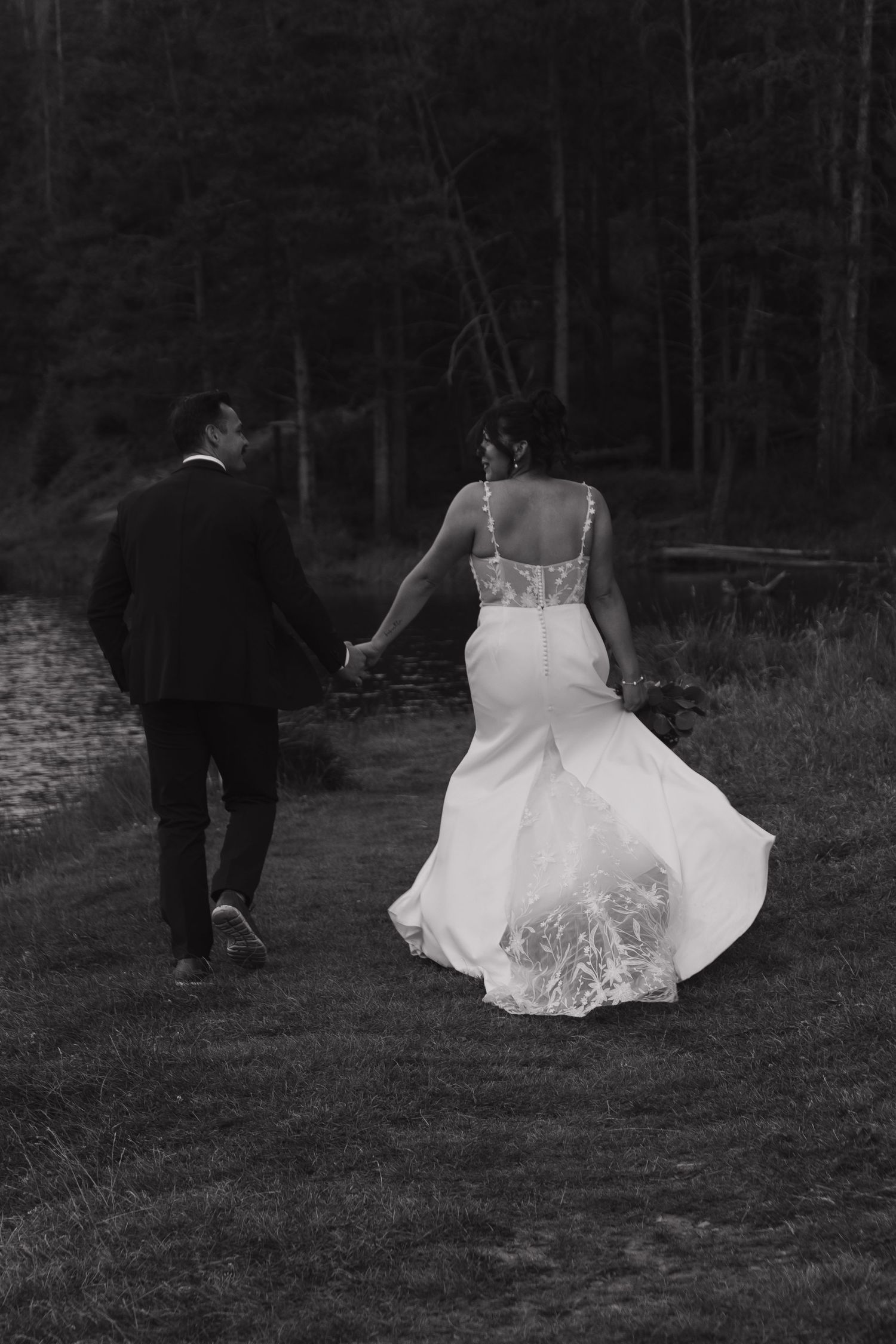 Black and white photos show wedding couple walking through a forested area.