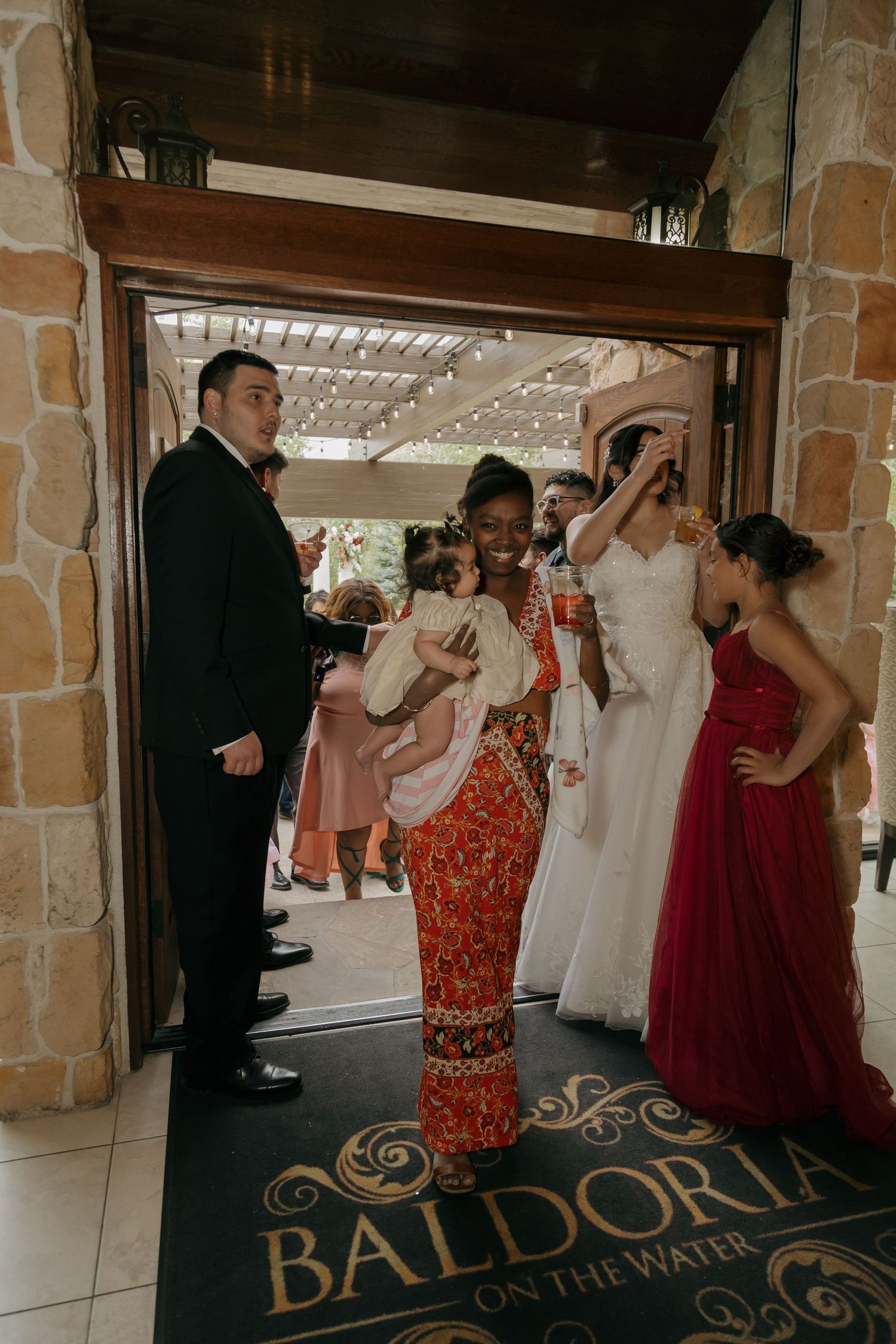 Wedding guests entering Baldoria on the Water venue during bride and groom reception arrival.