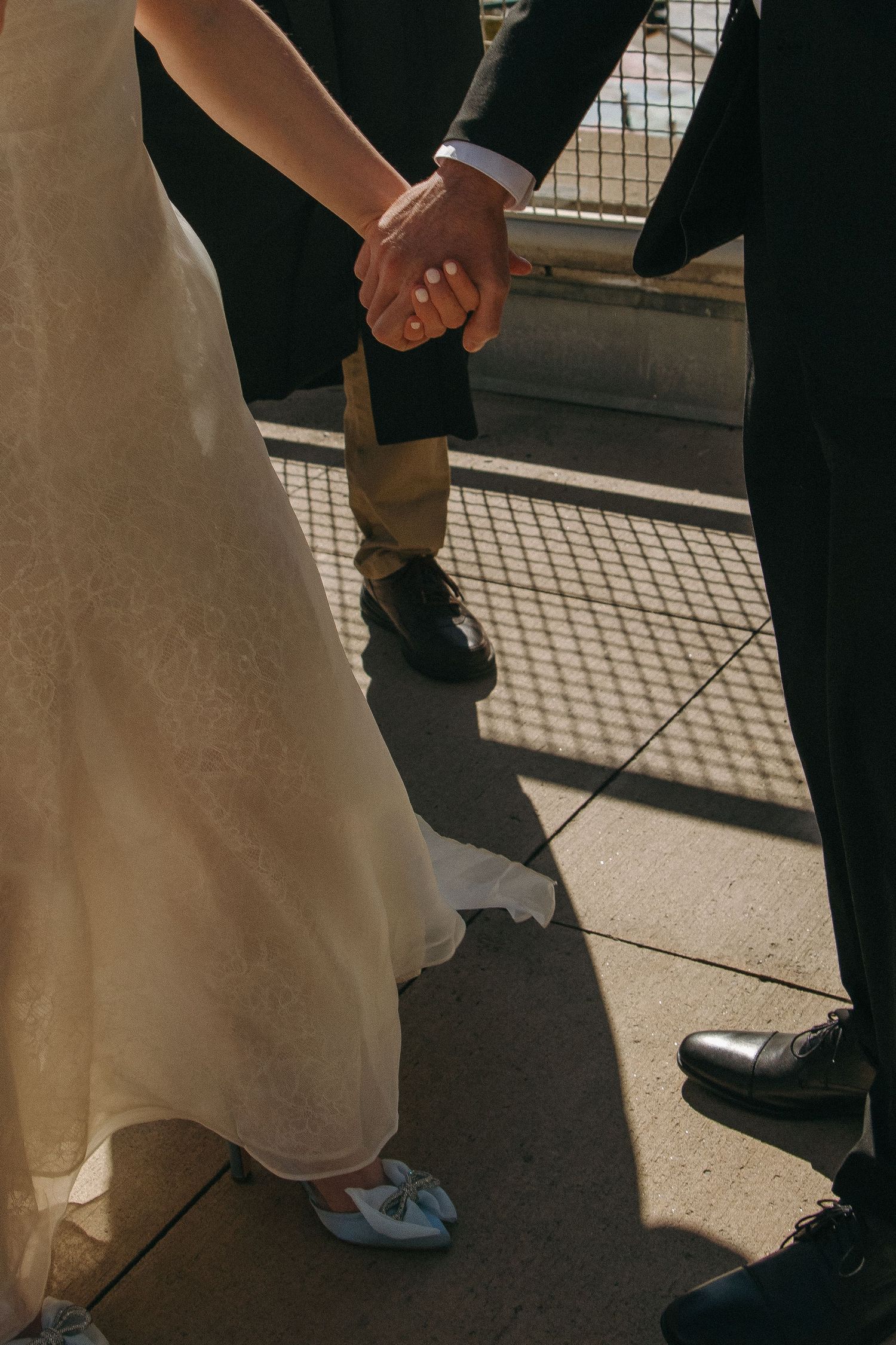 Close-up of bride and groom's feet during outdoor wedding photos.