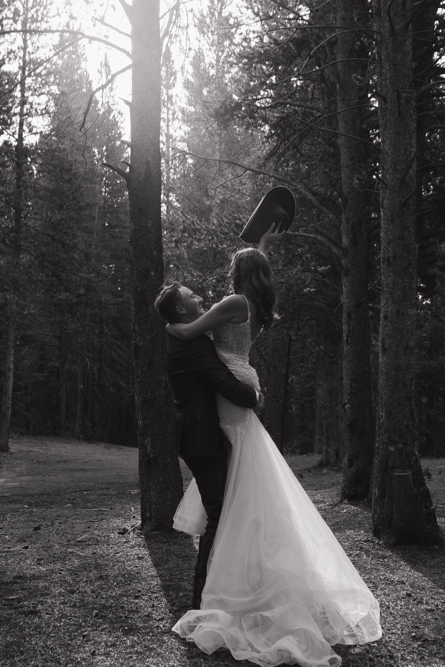 A romantic black and white wedding dance sequence in a forest setting.