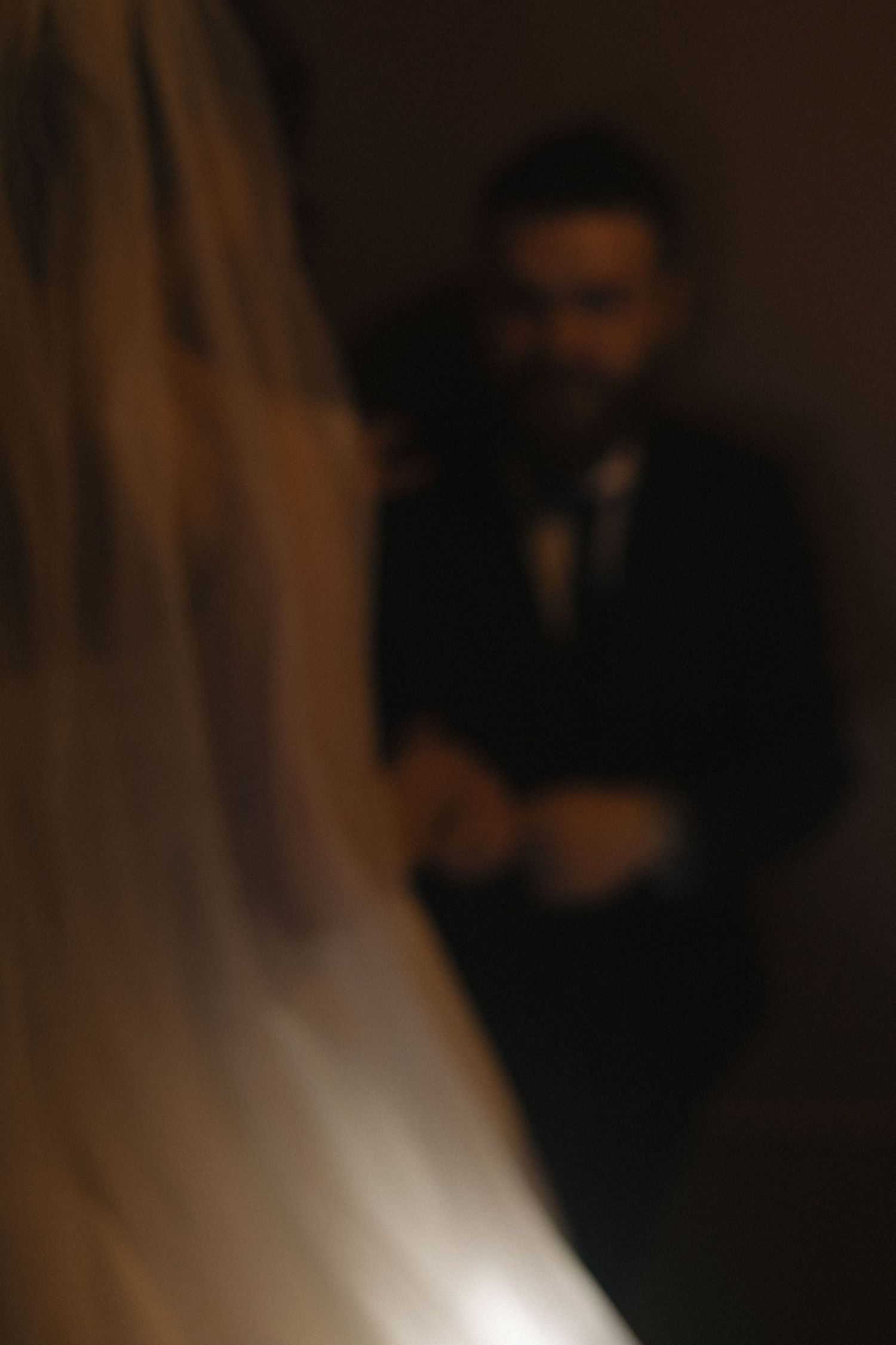 An artistic blurred shot of a wedding ceremony moment.