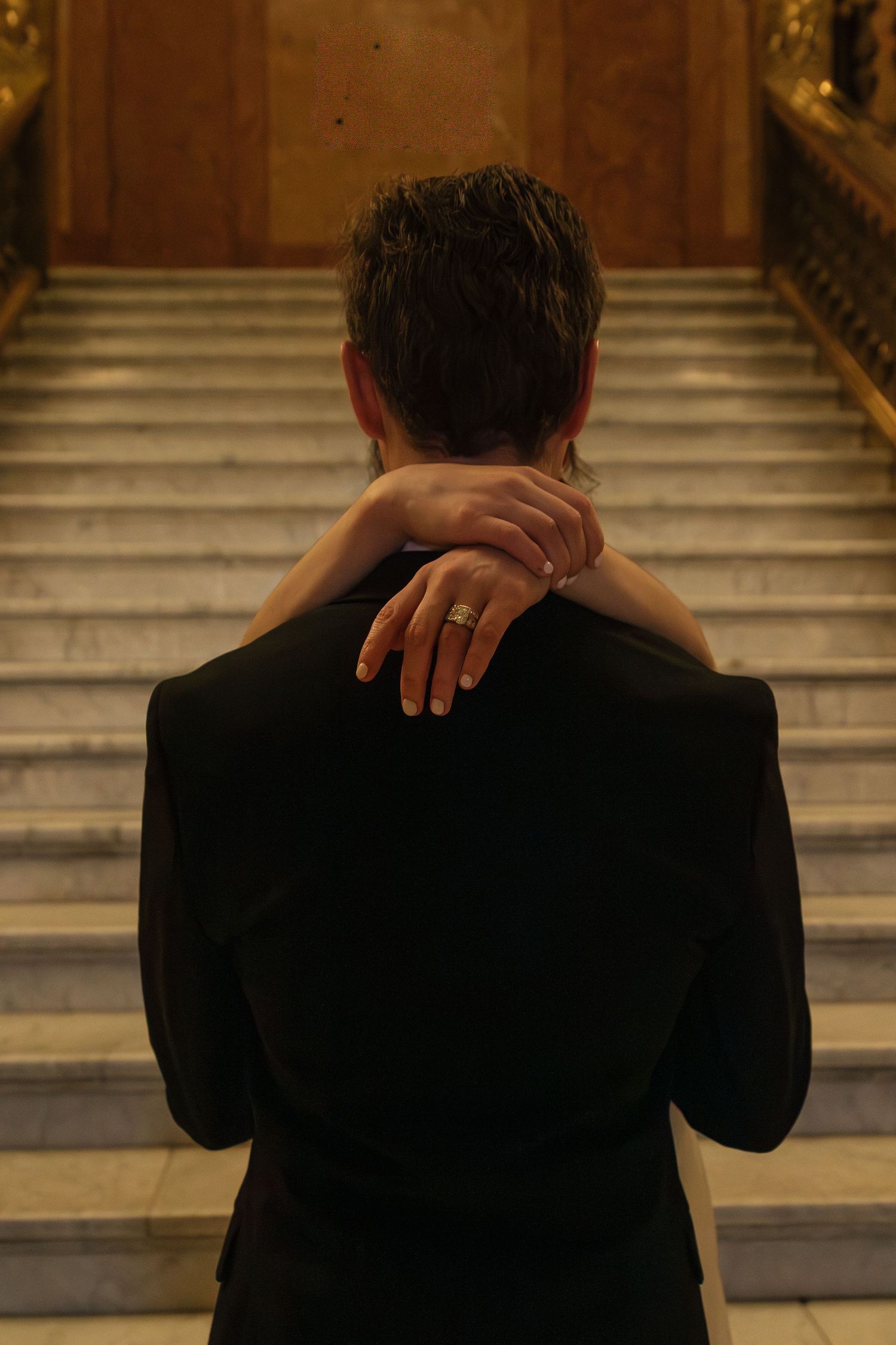 A series of photos showing someone covering their face with hands against a staircase backdrop.