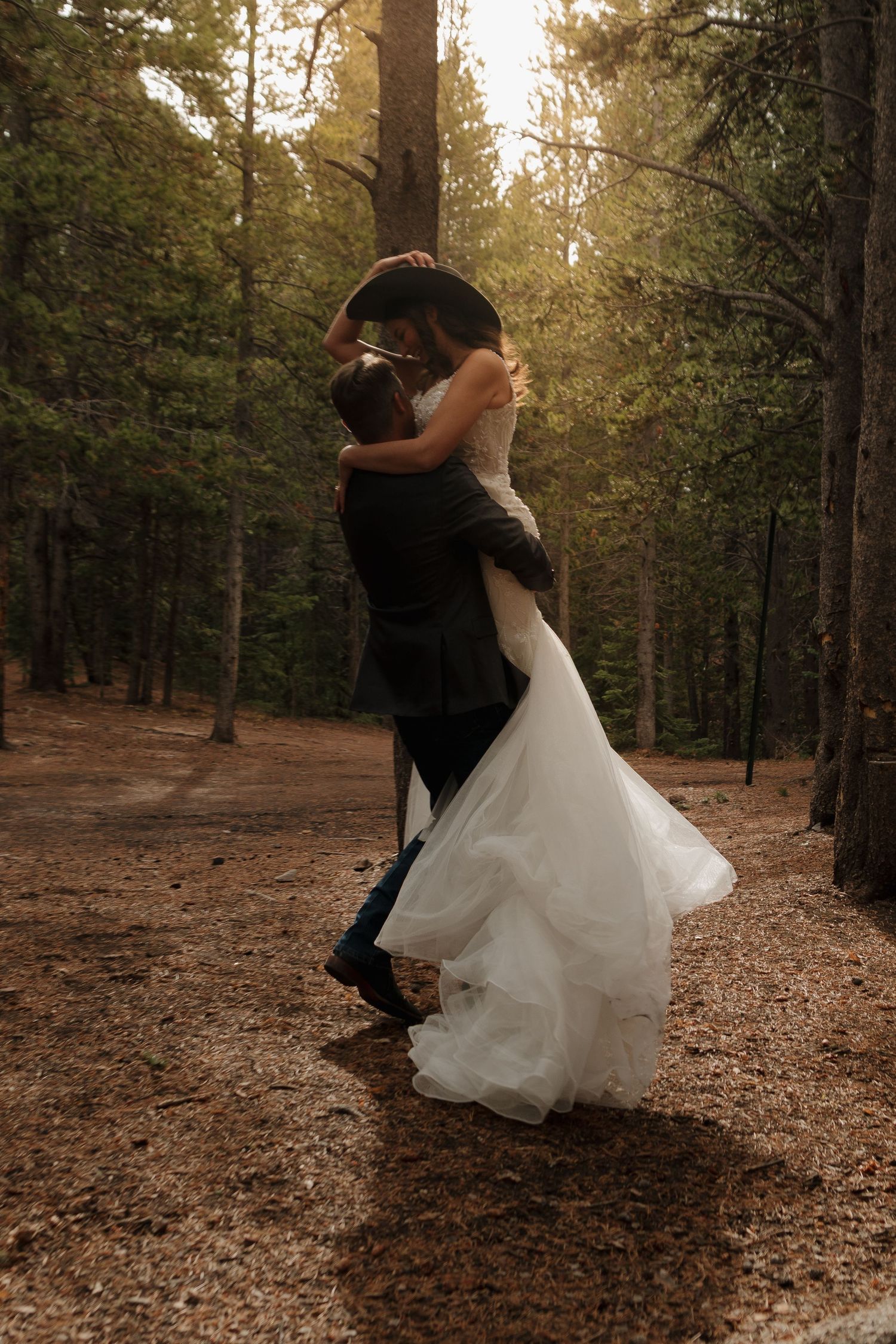 A romantic dance sequence in a forest setting with golden sunlight filtering through the trees.
