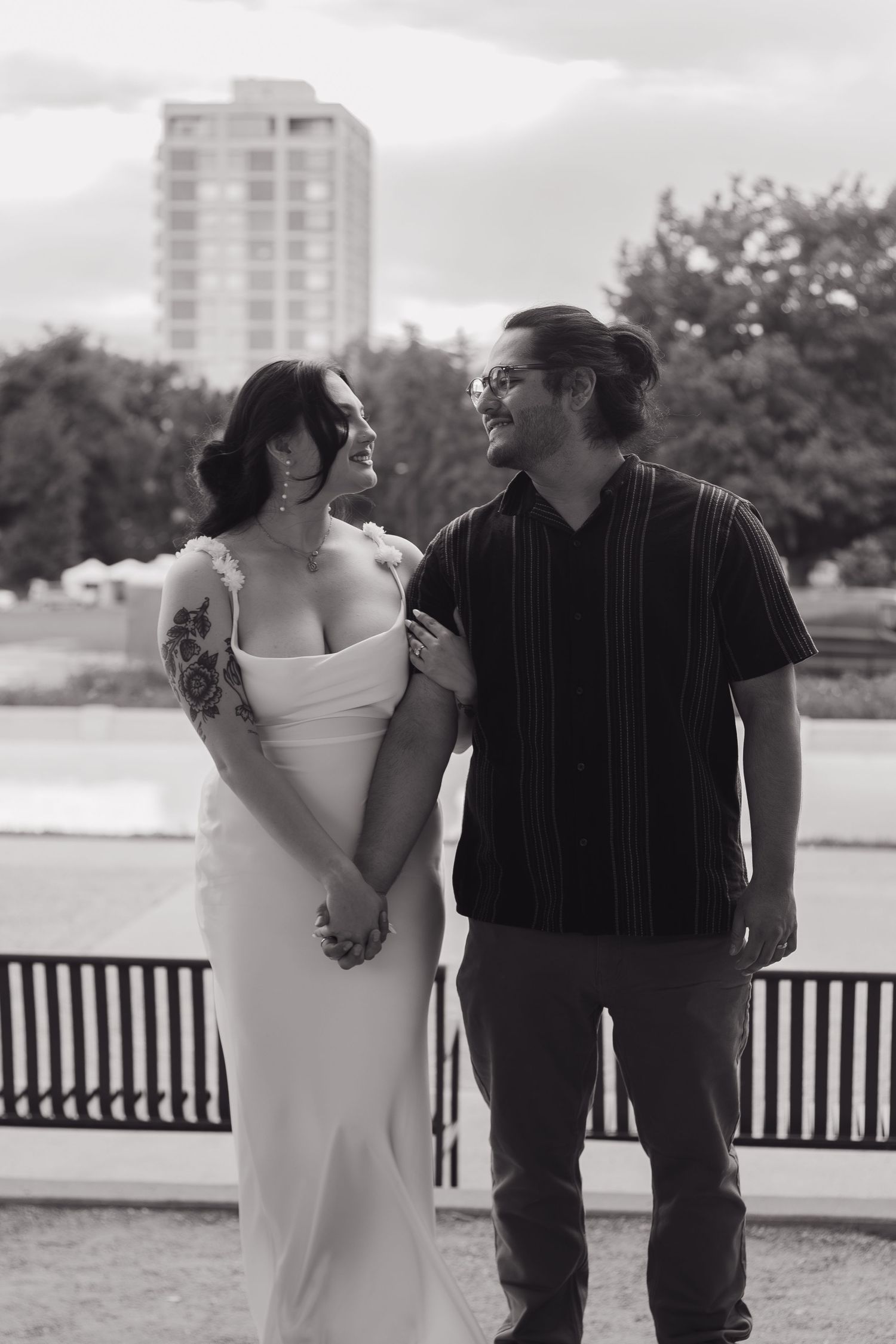 A romantic black and white photo sequence shows a couple sharing intimate moments on a bench outdoors.