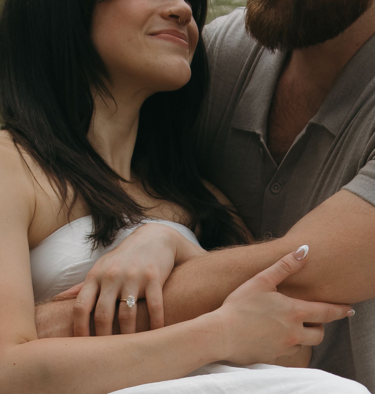 Close up shots of a couple embracing and holding each other in romantic poses.