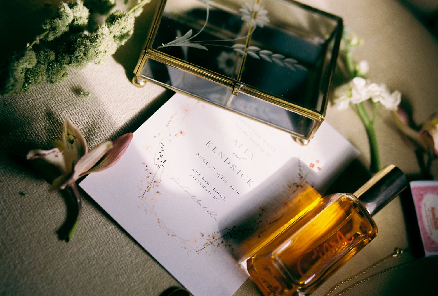 Handwritten notes and papers illuminated by warm lighting on a desk surface.
