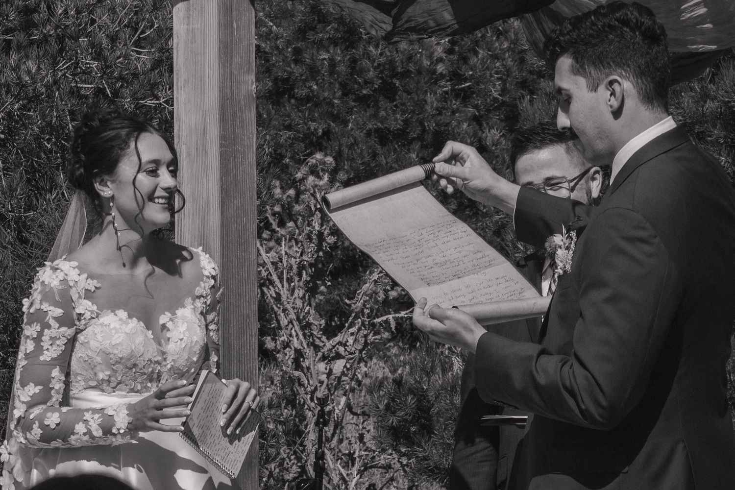 Close-up shots of wedding ceremony moments under wooden arch.