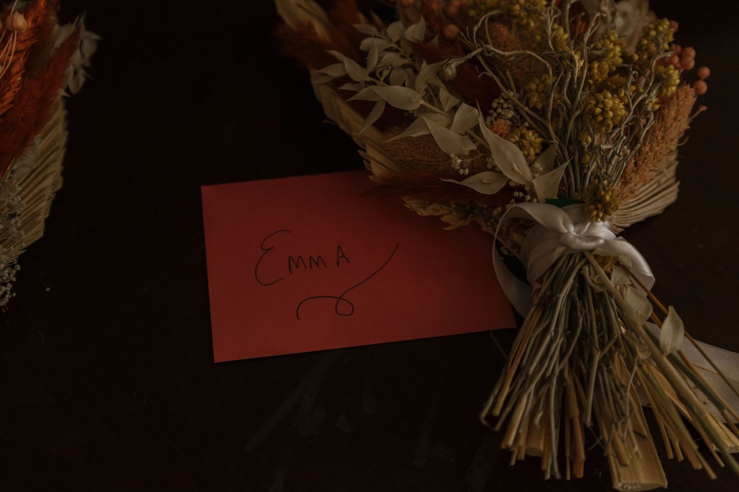 Dried floral arrangements and decorative elements displayed in warm lighting.