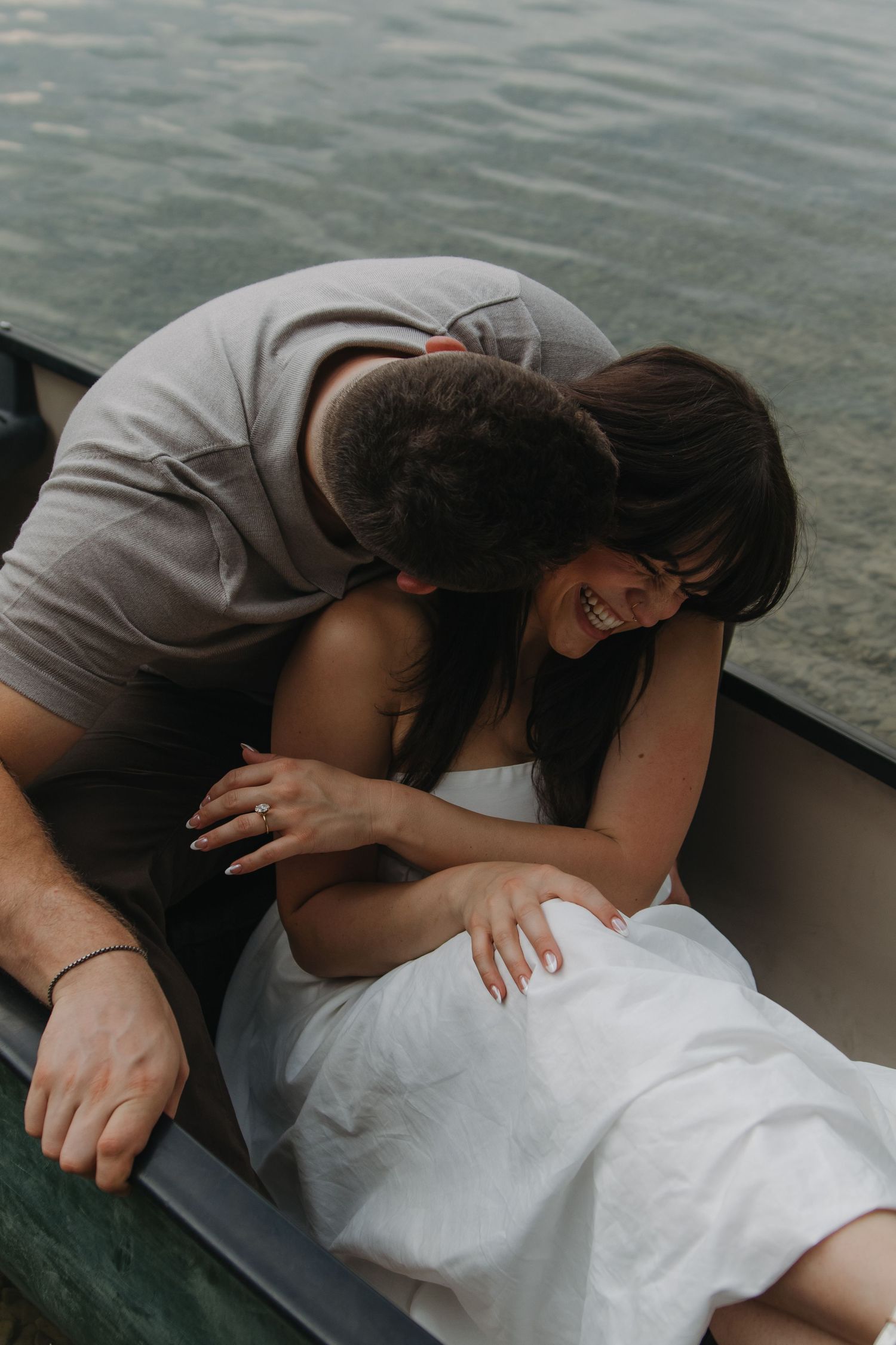 Tender embraces captured in a series of close-up shots on a boat.