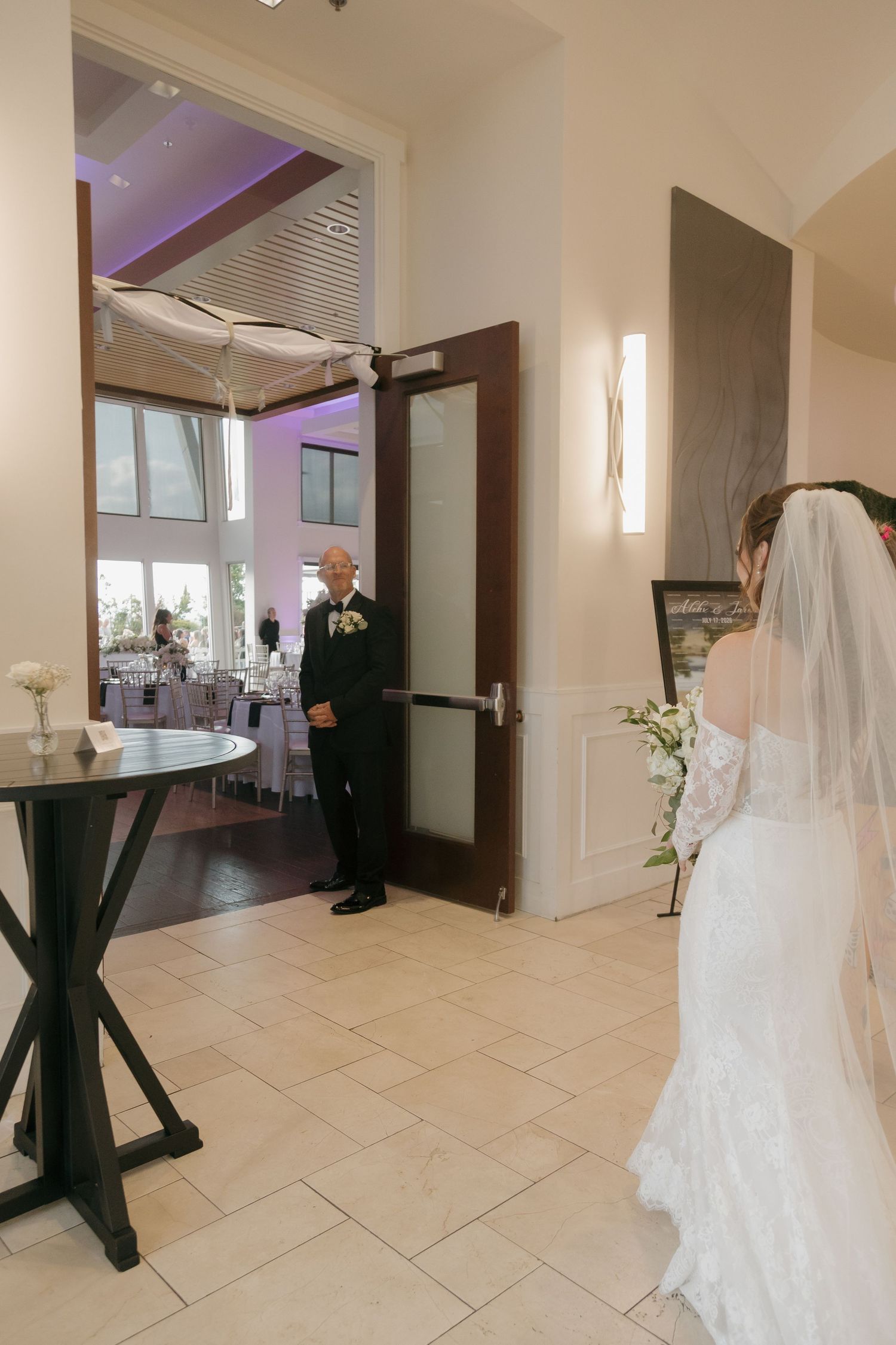 Father of the bride sees daughter in wedding gown for the first time during emotional first look.