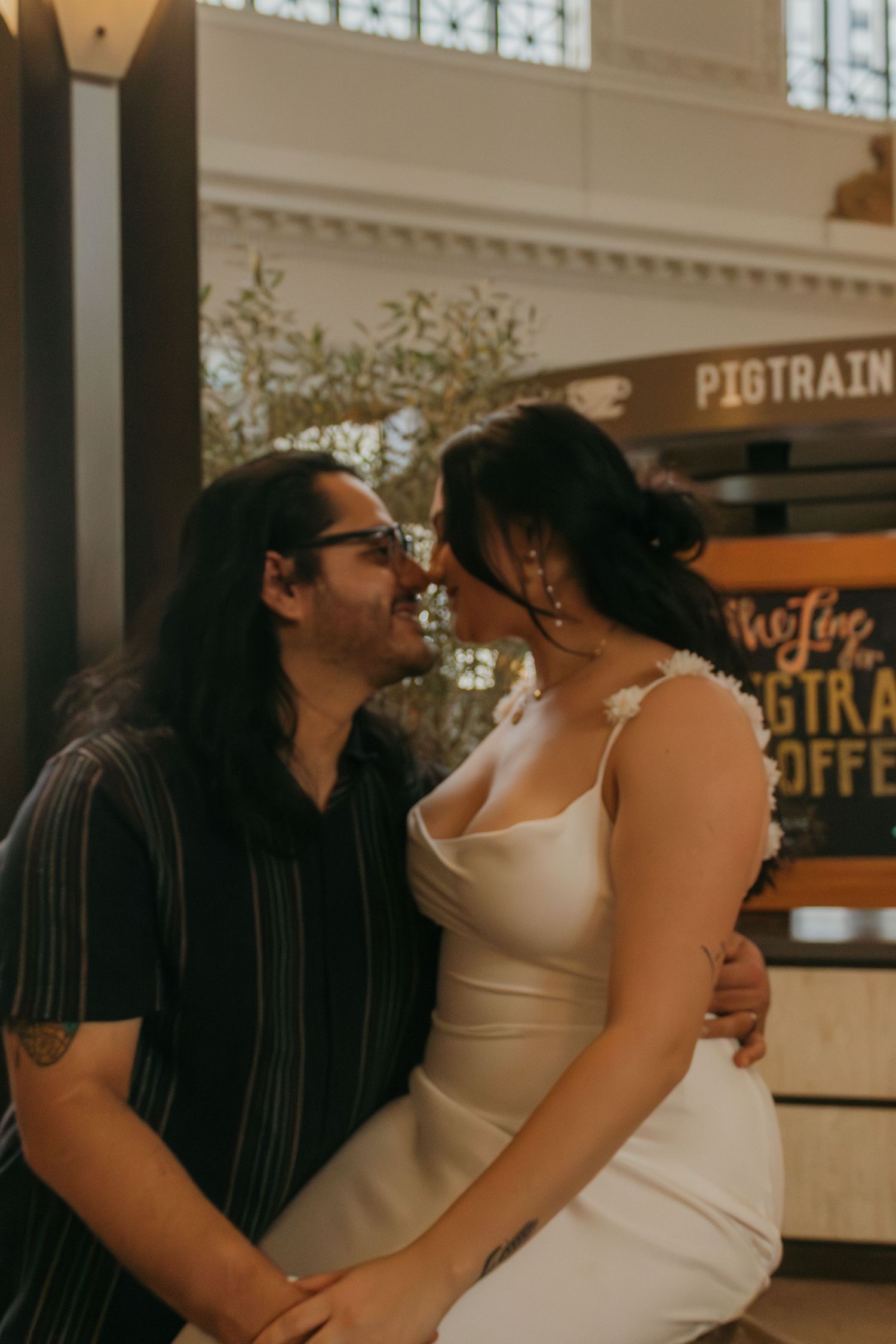A collage of candid intimate moments showing couples in white outfits having tender interactions indoors.