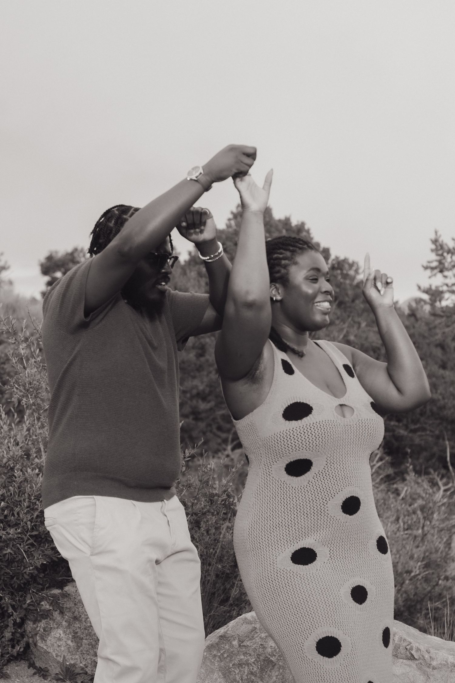 A joyful dancing moment outdoors showing celebration and happiness.