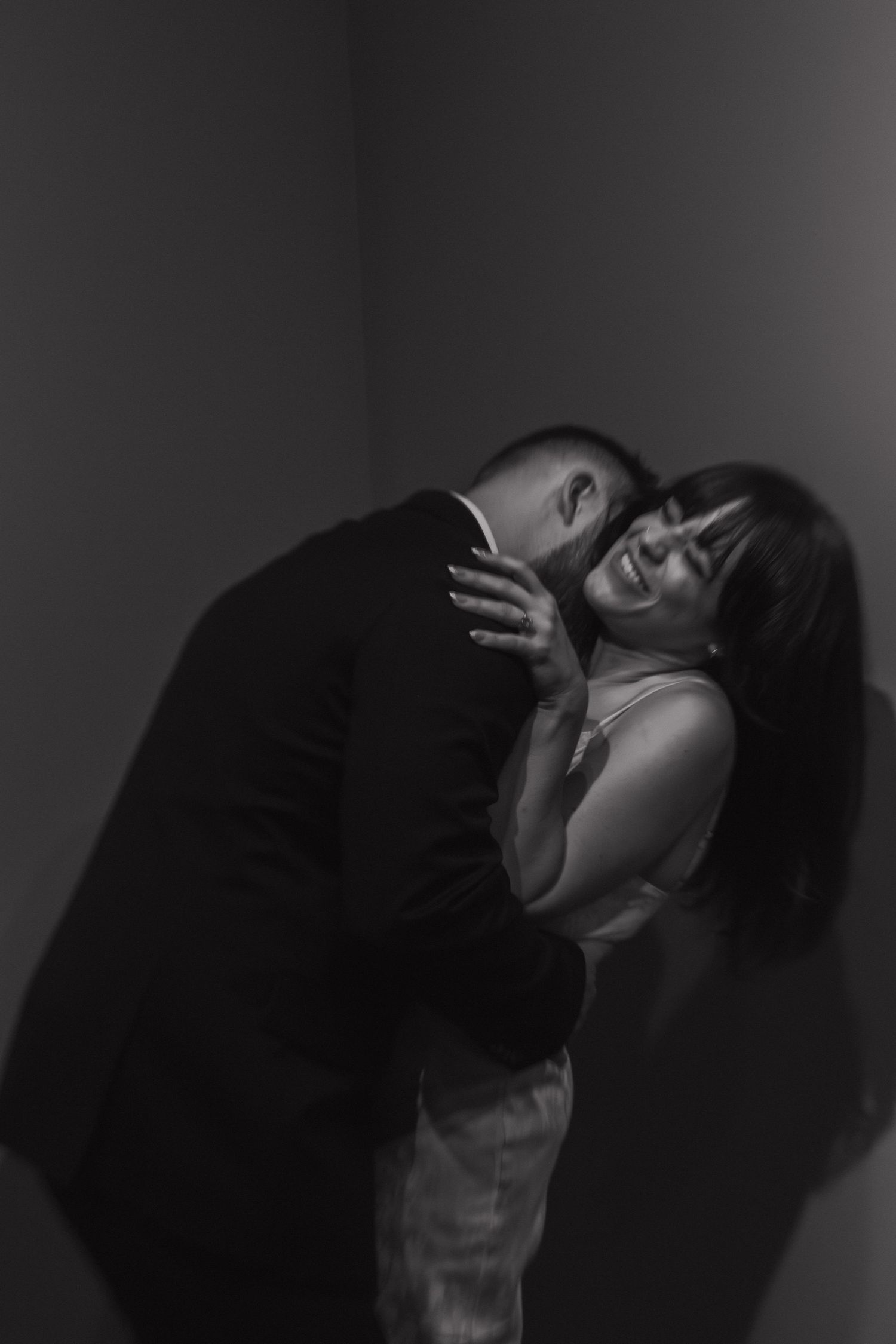 An artistic black and white photo sequence captures intimate moments between two people.