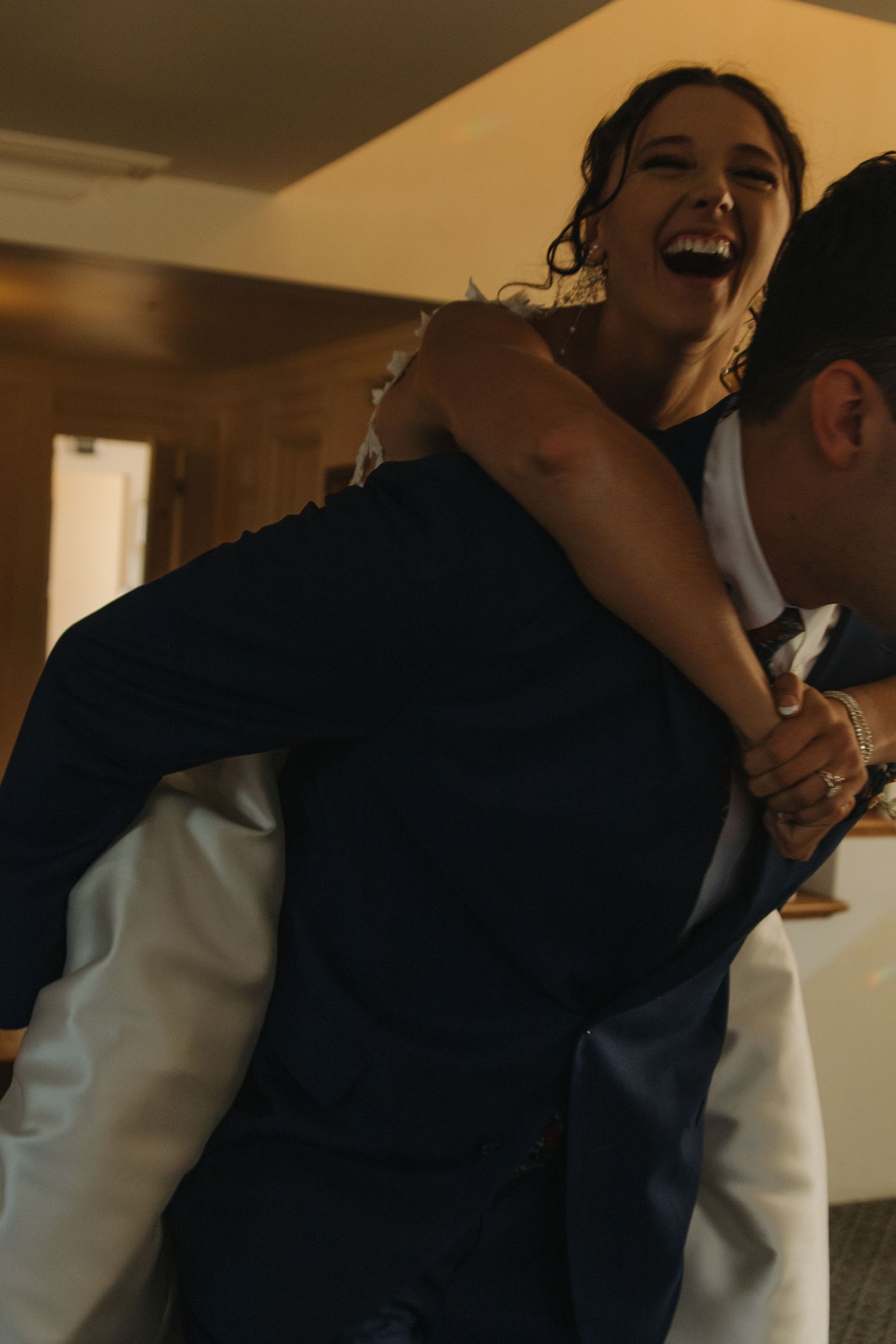 Guests dancing and celebrating during lively wedding reception festivities.