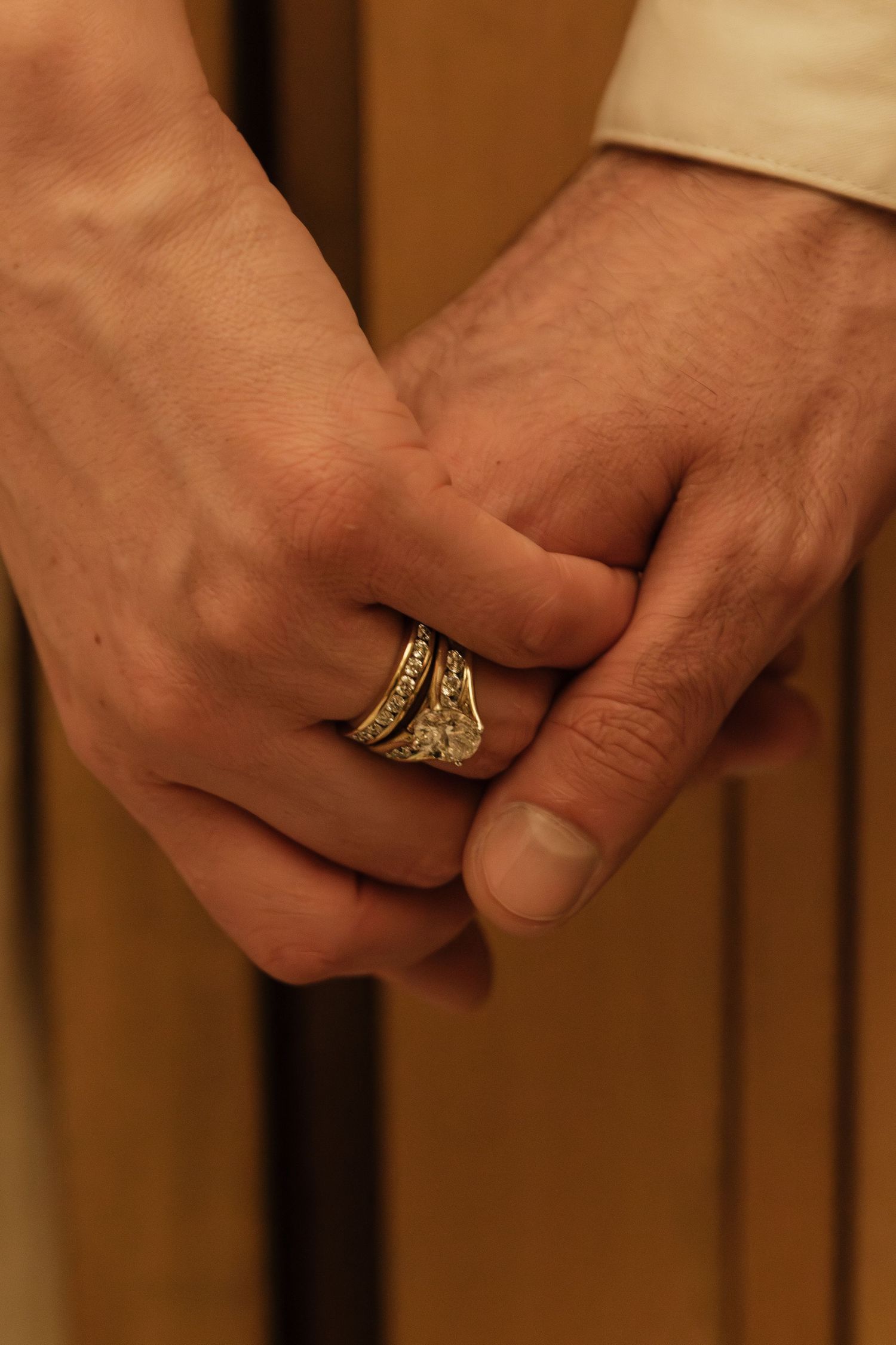 Close-up shots of hands wearing ornate rings in sequence.