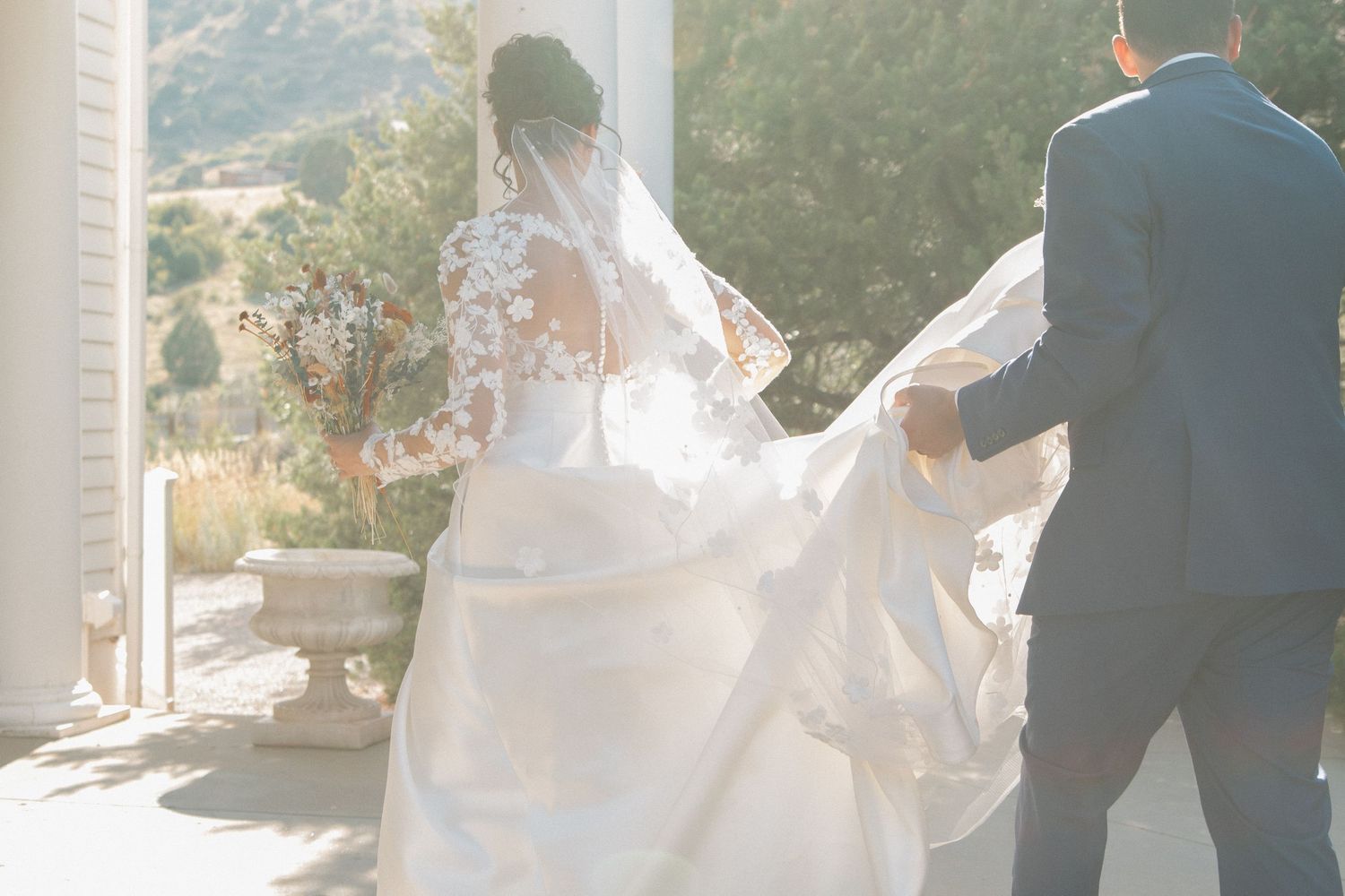Light and airy wedding venue interior with mountain views through large windows.