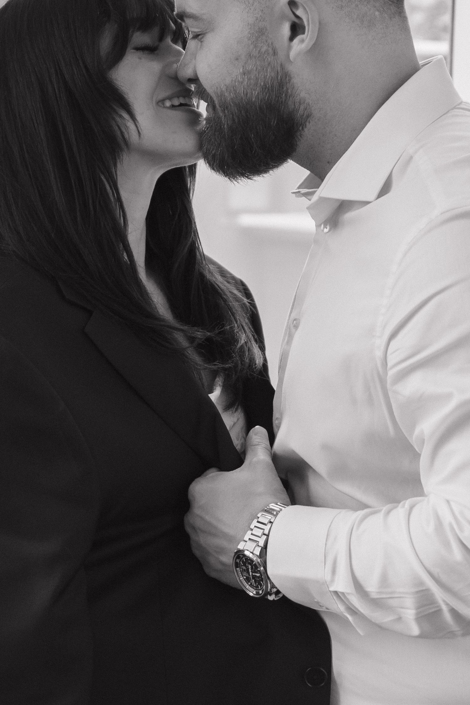 Black and white intimate portraits of a couple in close embrace.