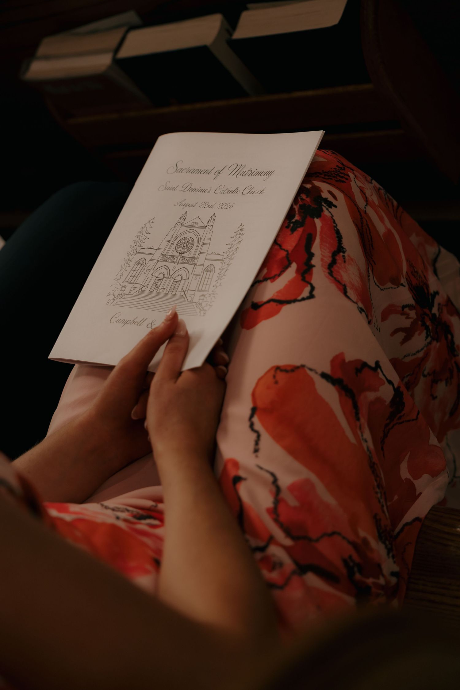 Guest reads Sacrament of Matrimony Catholic church wedding program.