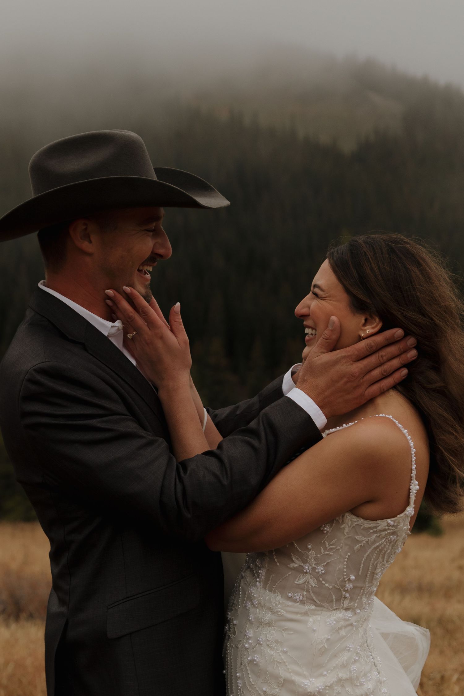 Couple shares emotional moments during their wedding ceremony in a rustic outdoor setting.