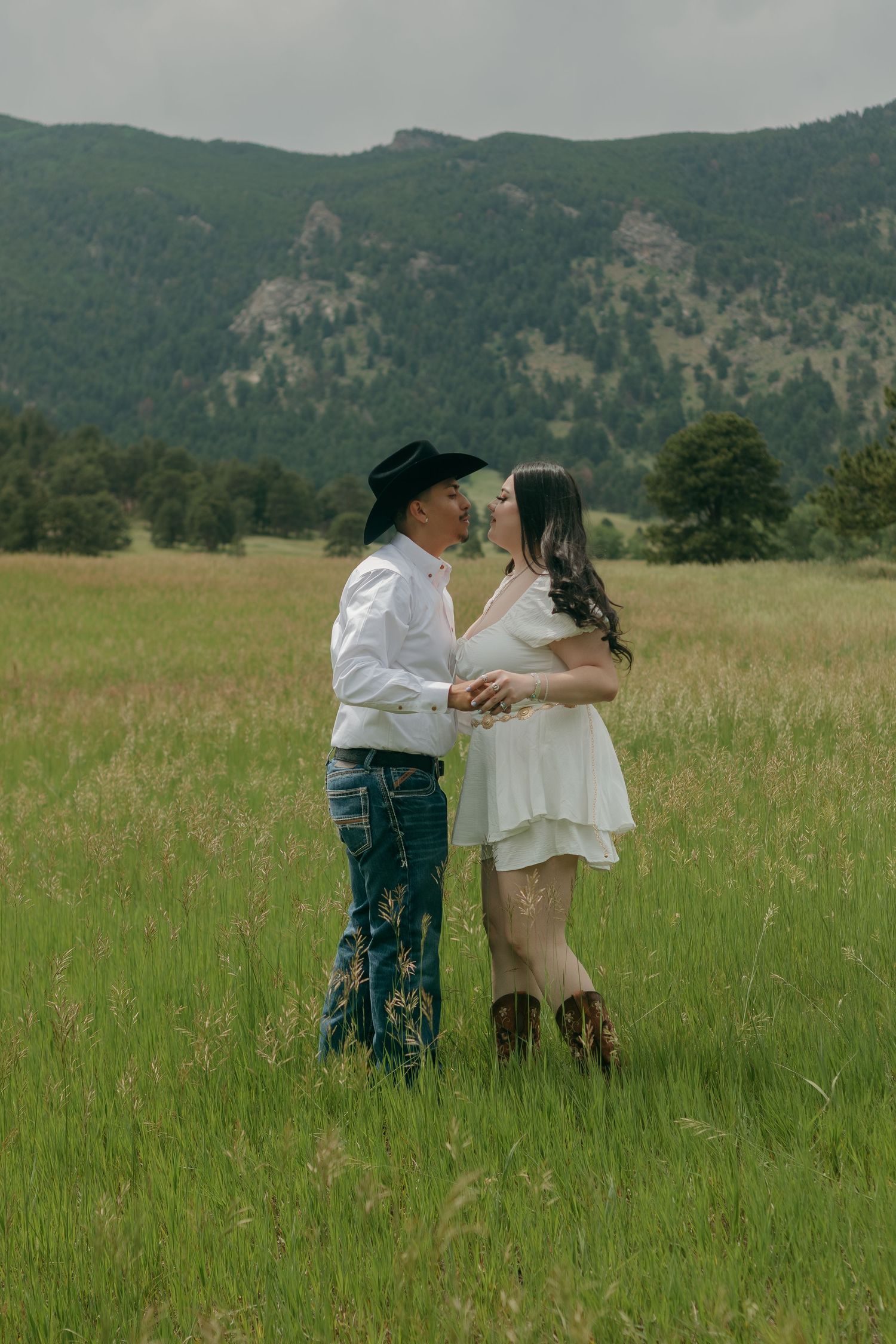 A playful dance sequence captured in a scenic mountain meadow.