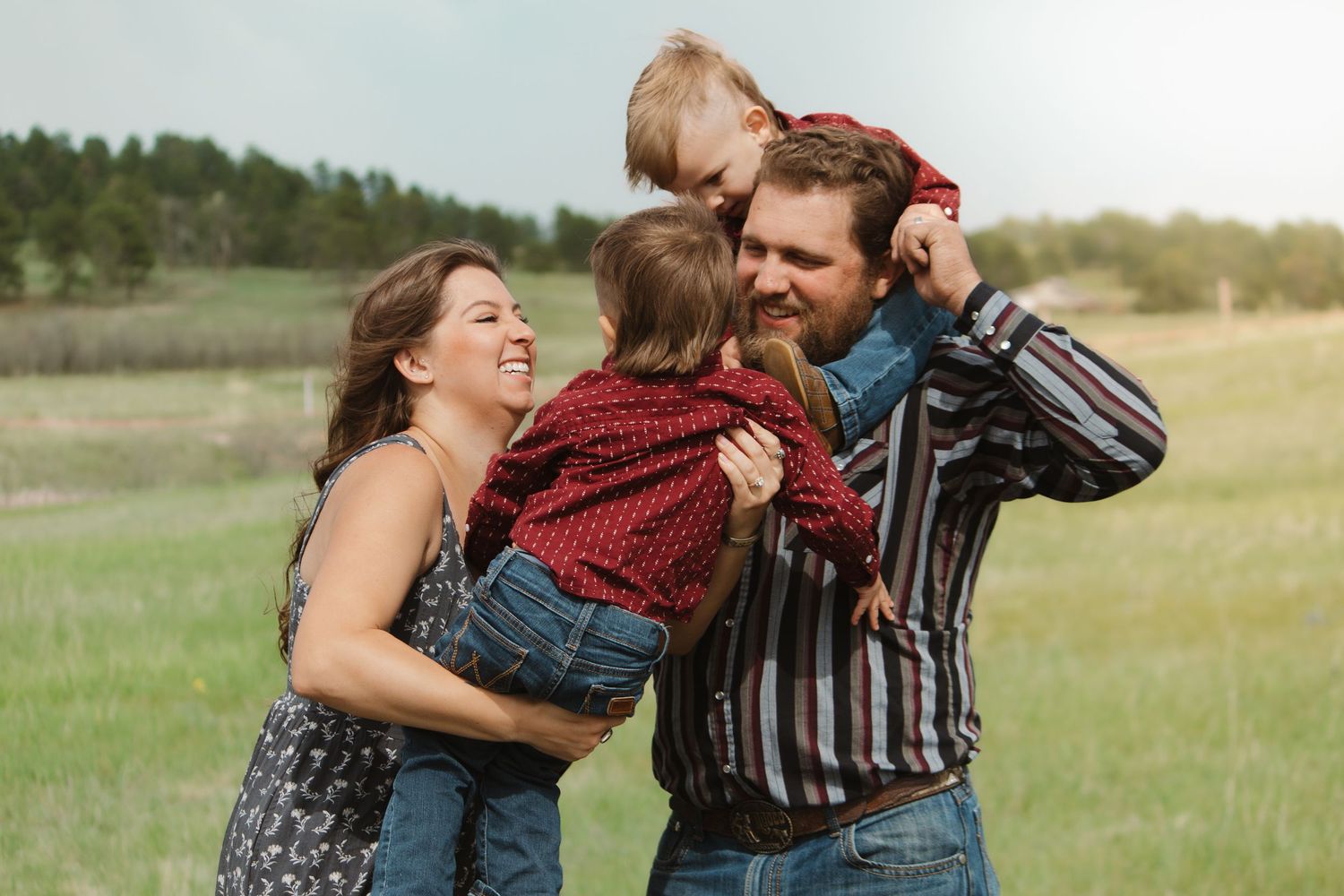 Candid family photos showing affectionate moments between family members in an outdoor setting.