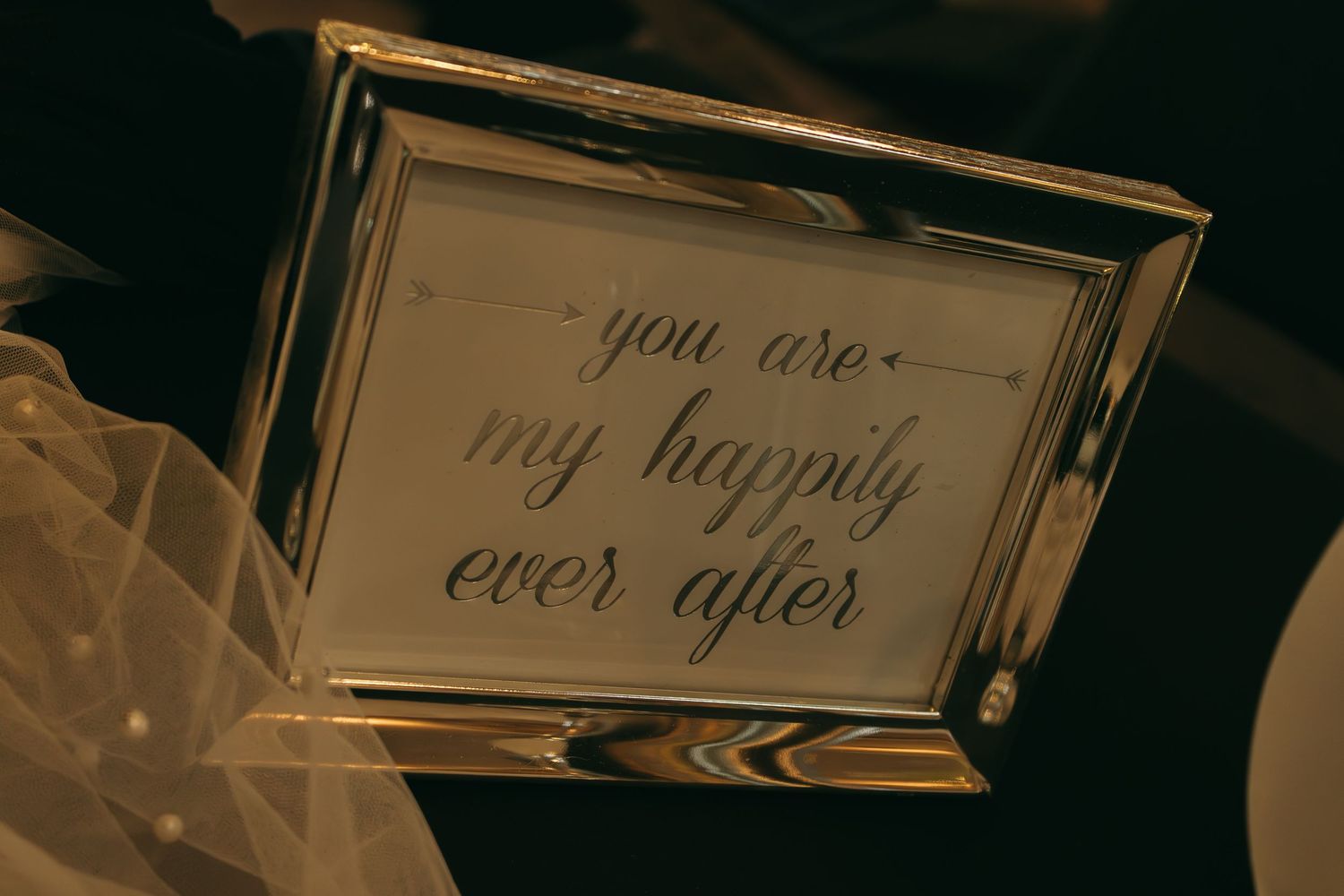 Wedding signage with romantic text in elegant script font.