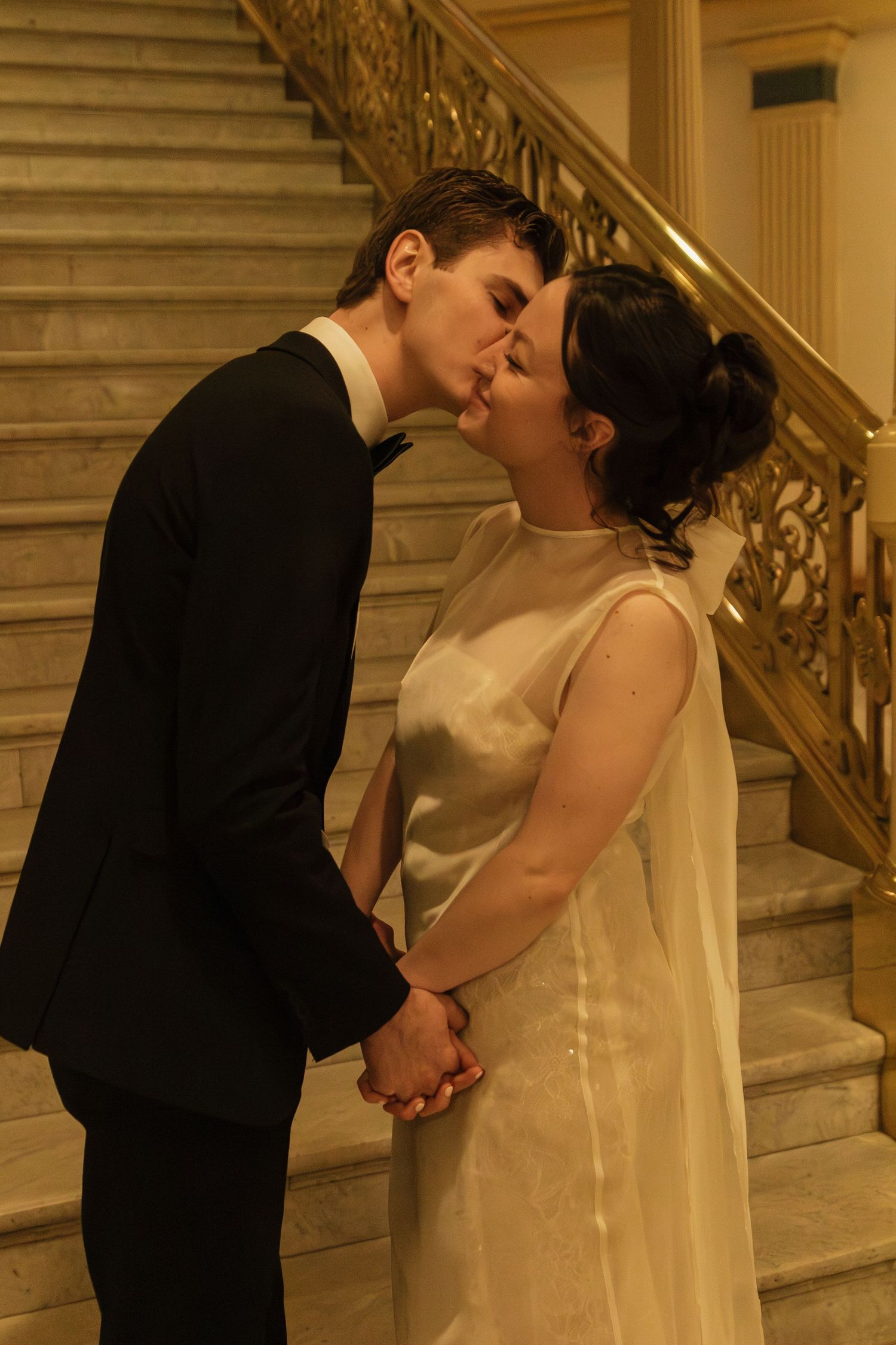 A romantic sequence of moments captured on an elegant marble staircase.