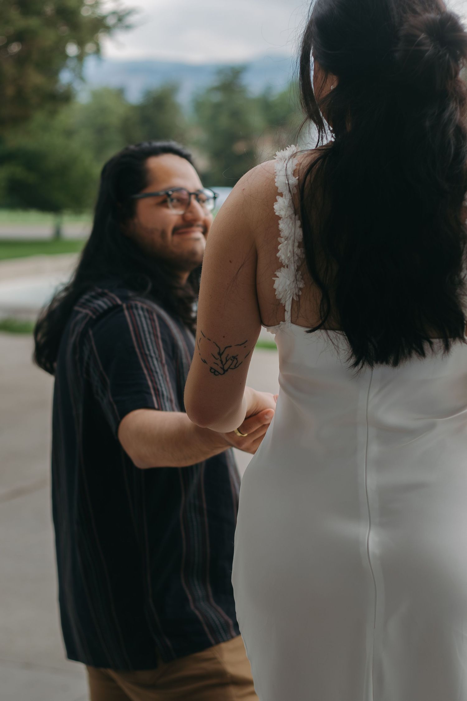 A joyful dance moment captured outdoors between a couple.