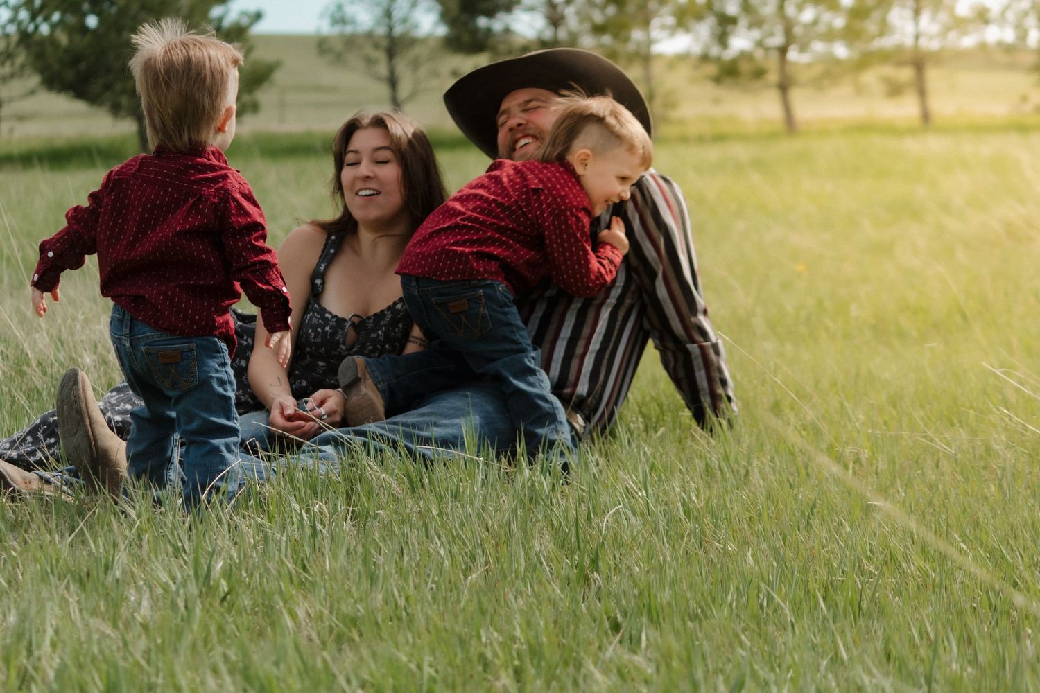 A series of candid moments captured in a sunlit field with trees in the background.