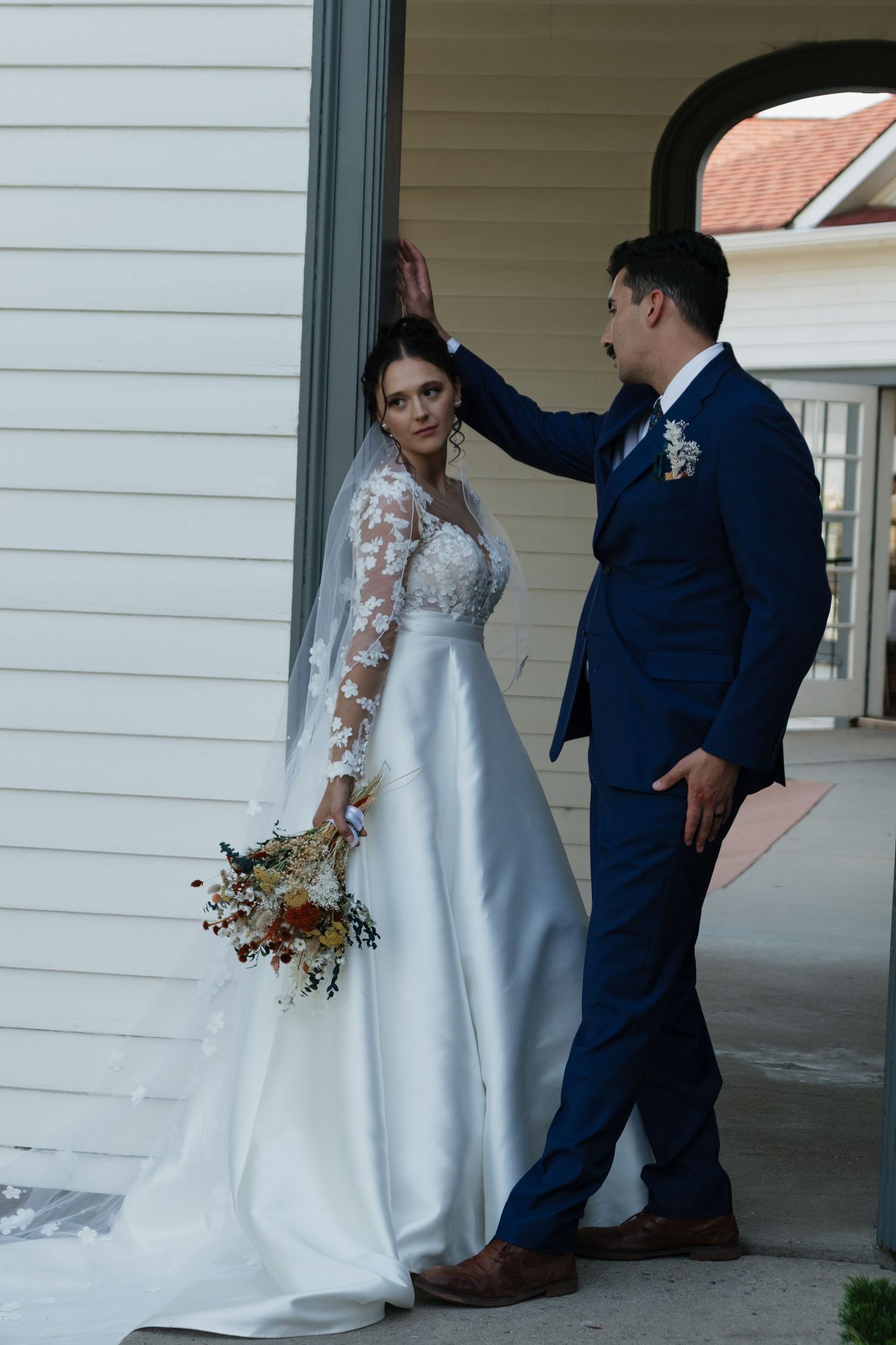 A sequence of wedding photos captured on a covered porch with white siding.